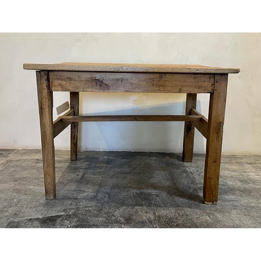 Antique French Walnut Dining Table, c 1890

This antique walnut table, circa 1890 has character and charm. The maker of this piece combined craftsmanship and resourcefulness. The craftsmanship is in the simple details like the wooden pegs attaching