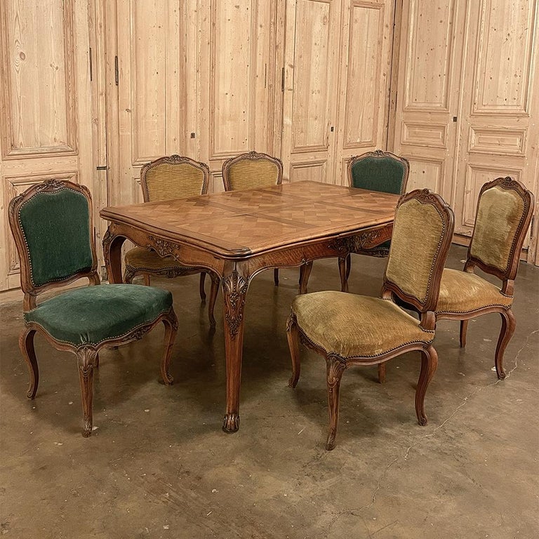Antique French walnut Louis XV draw leaf dining table is a splendid example of the design, which provides comfortable seating for 6 year round, then when family or friends drop by, two leaves draw out independently to add seating accommodations up