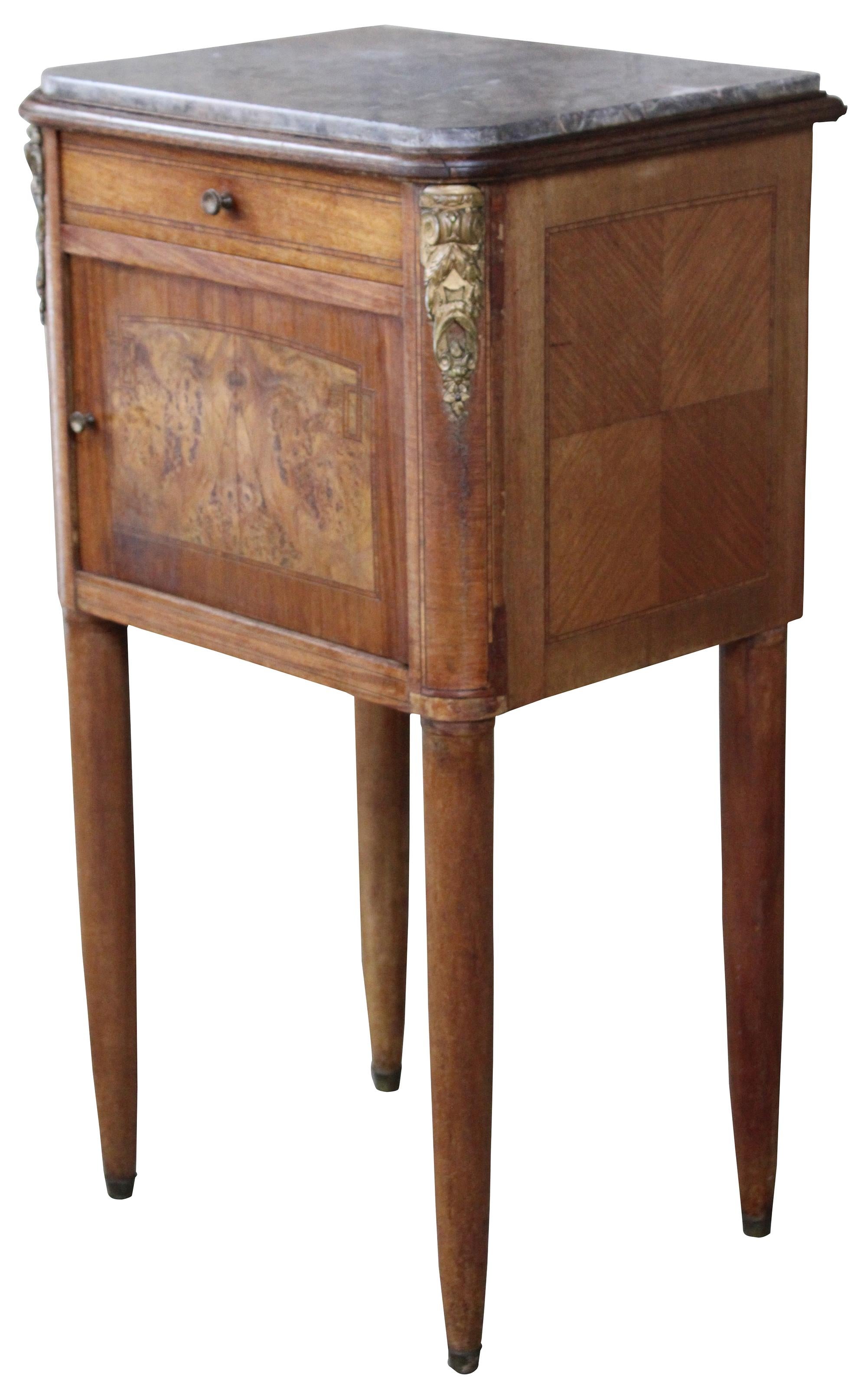 Antique 19th century French humidor table. Features a hand dovetailed drawer and lower marble lined tobacco cabinet. Made from walnut with an inset marble top, ormolu mounts, inlay and burled cabinet front. Measure: 34