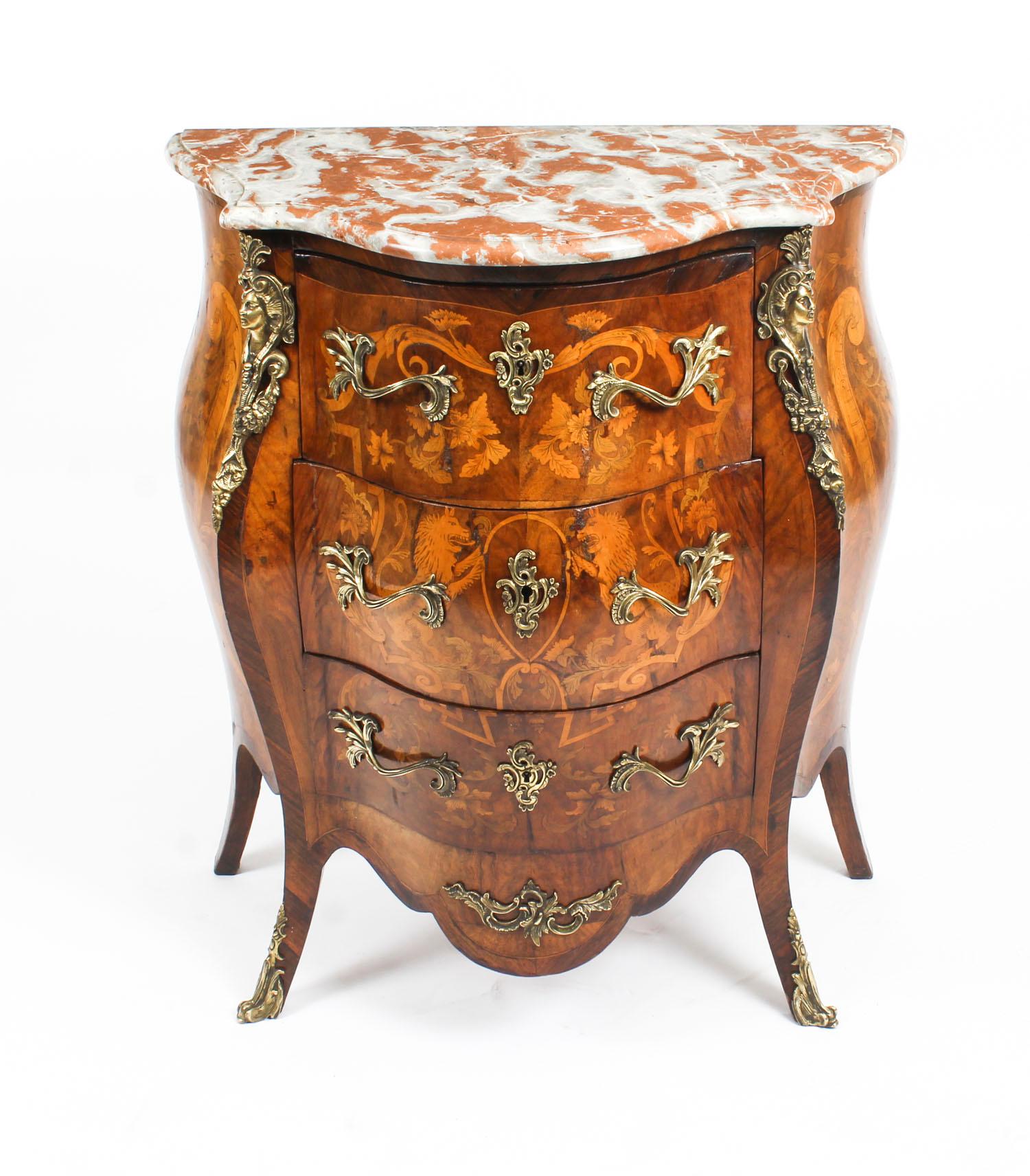 This is a stunning antique French Louis Revival burr walnut serpentine fronted bombe' marble top commode, circa 1880 in date. 

This gorgeous commode has three graduated drawers for ample storage, and was inspired by the Louis XV style.