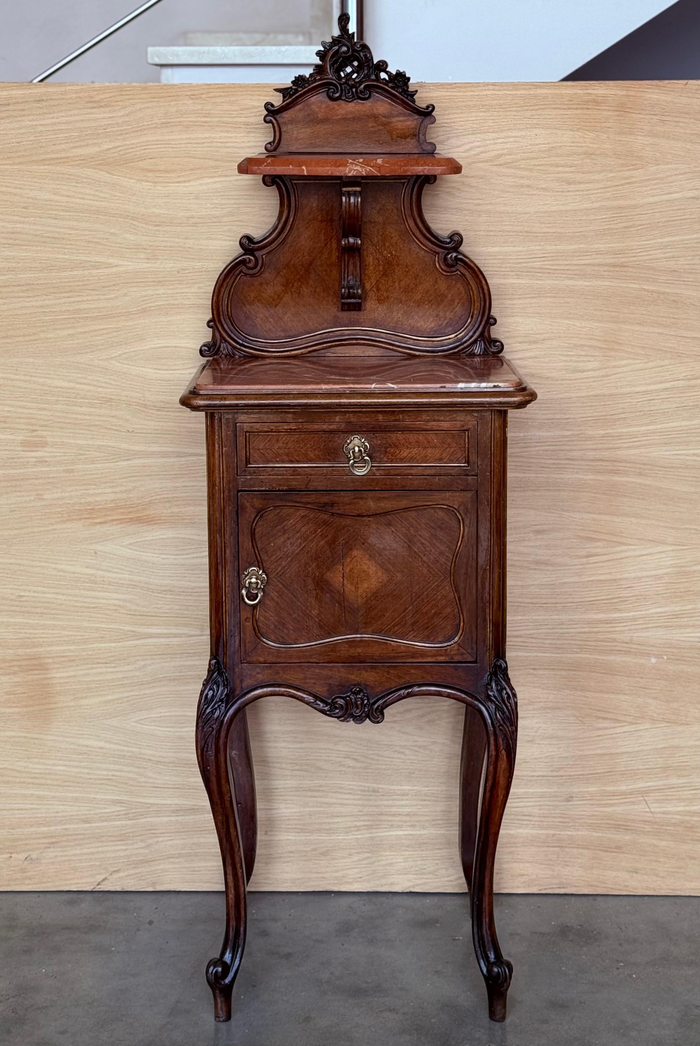 Two very nice elegant France nightstands. Grey marble tops on cabriole legs. The interior compartment was made of white marble. Bronze handles. Walnut wood.

Height from the floor to the marble top : 33.85in