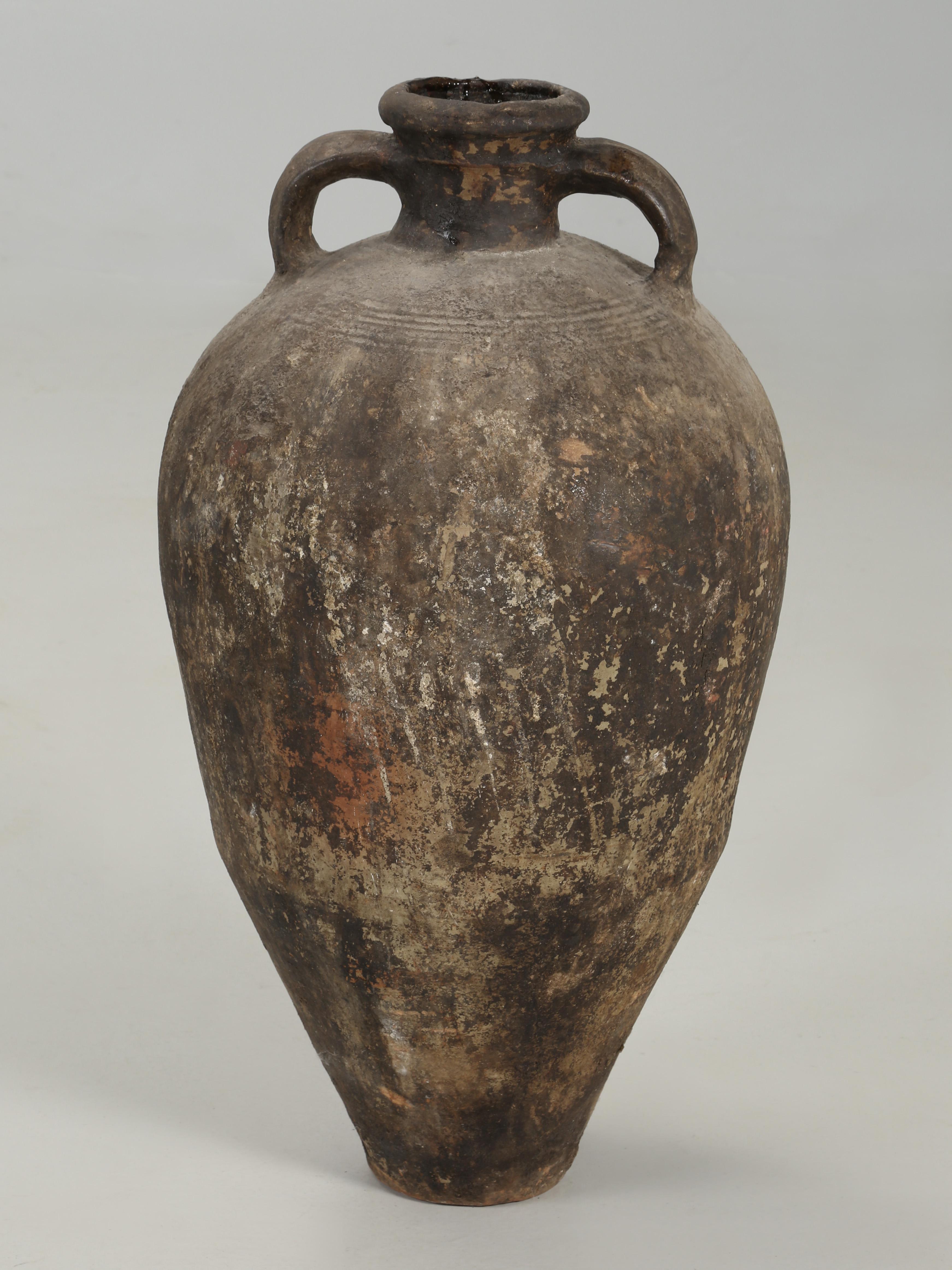 Antique French 19th century Provencal walnut oil jar or jug made of earthenware. We are quite confident that it was used for walnut oil, because there is still some in the jar. The French walnut oil jars were typically used to transport the locally