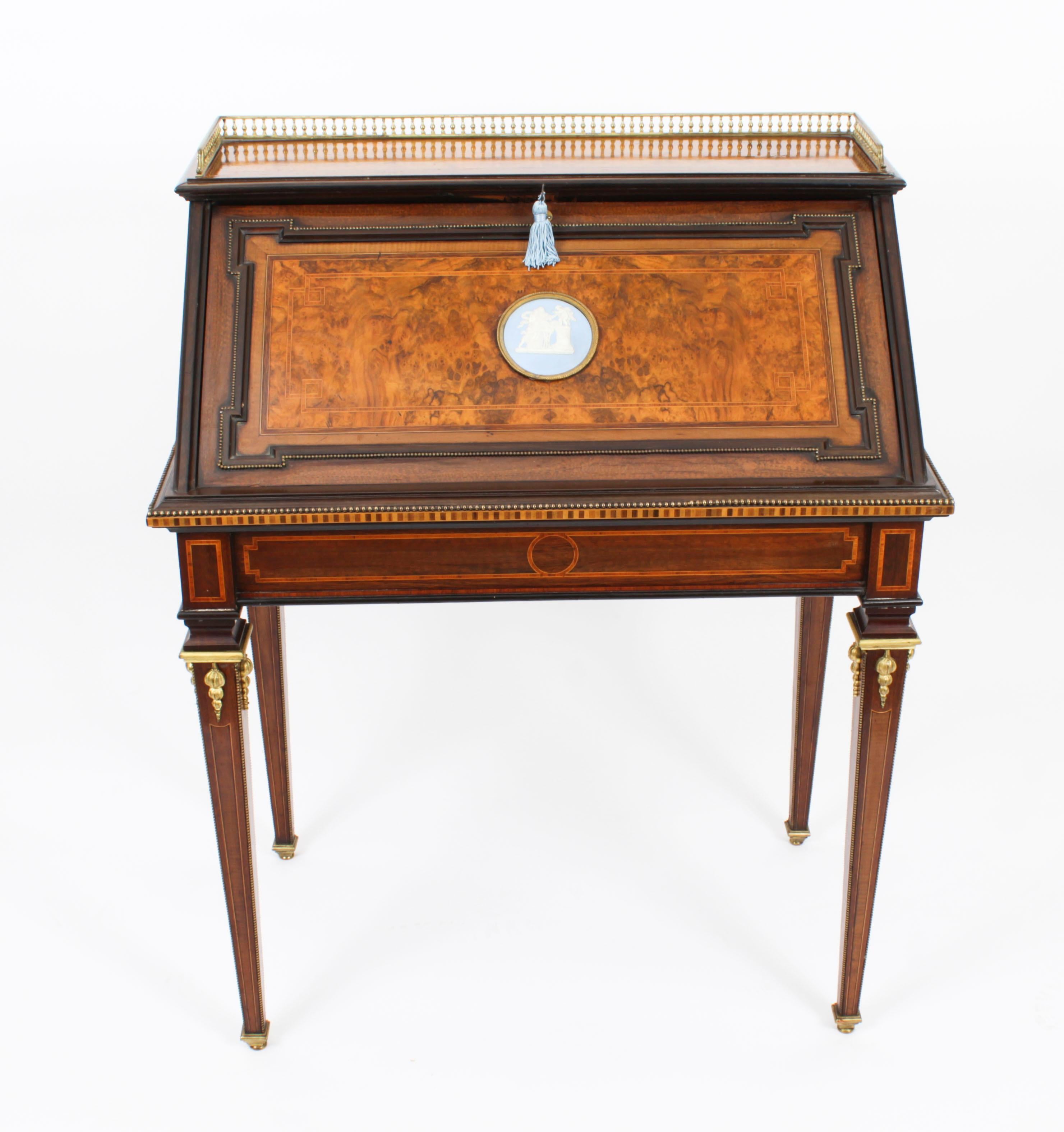 A superb Victorian burr walnut parquetry and ormolu mounted Bureau De Dame, circa 1870 in date.
 
The fall front features a decorative Jasperware ormolu mounted plaque and opens to reveal a satinwood fitted interior with a large pigeon hole, three