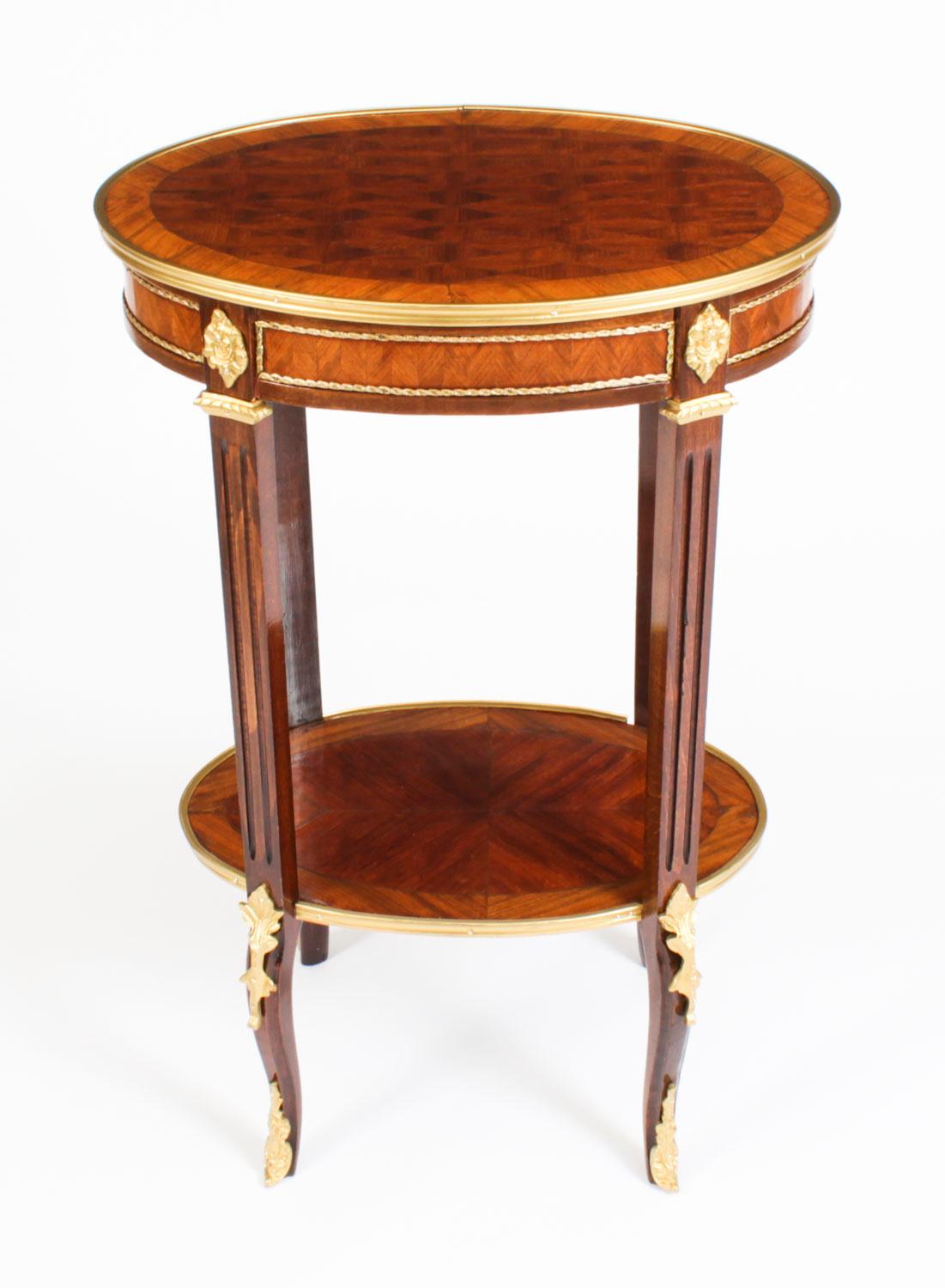 This is a beautiful antique French walnut banded oval occasional table, circa 1880 in date.

It has been masterfully crafted from beautiful parquetry decoration and ormolu mounts. It is raised on elegant fluted legs united by a decorative
