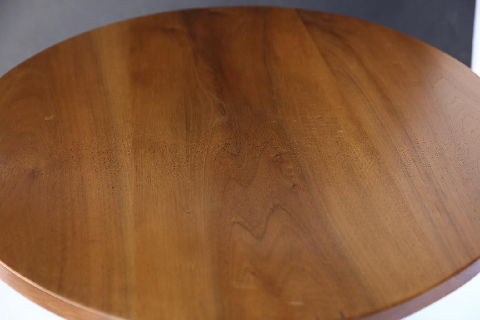 Made of walnut, this beautiful pedestal table is strong and sturdy. The table features a round top poised on a turned pedestal with tripod legs and a hand waxed finish.