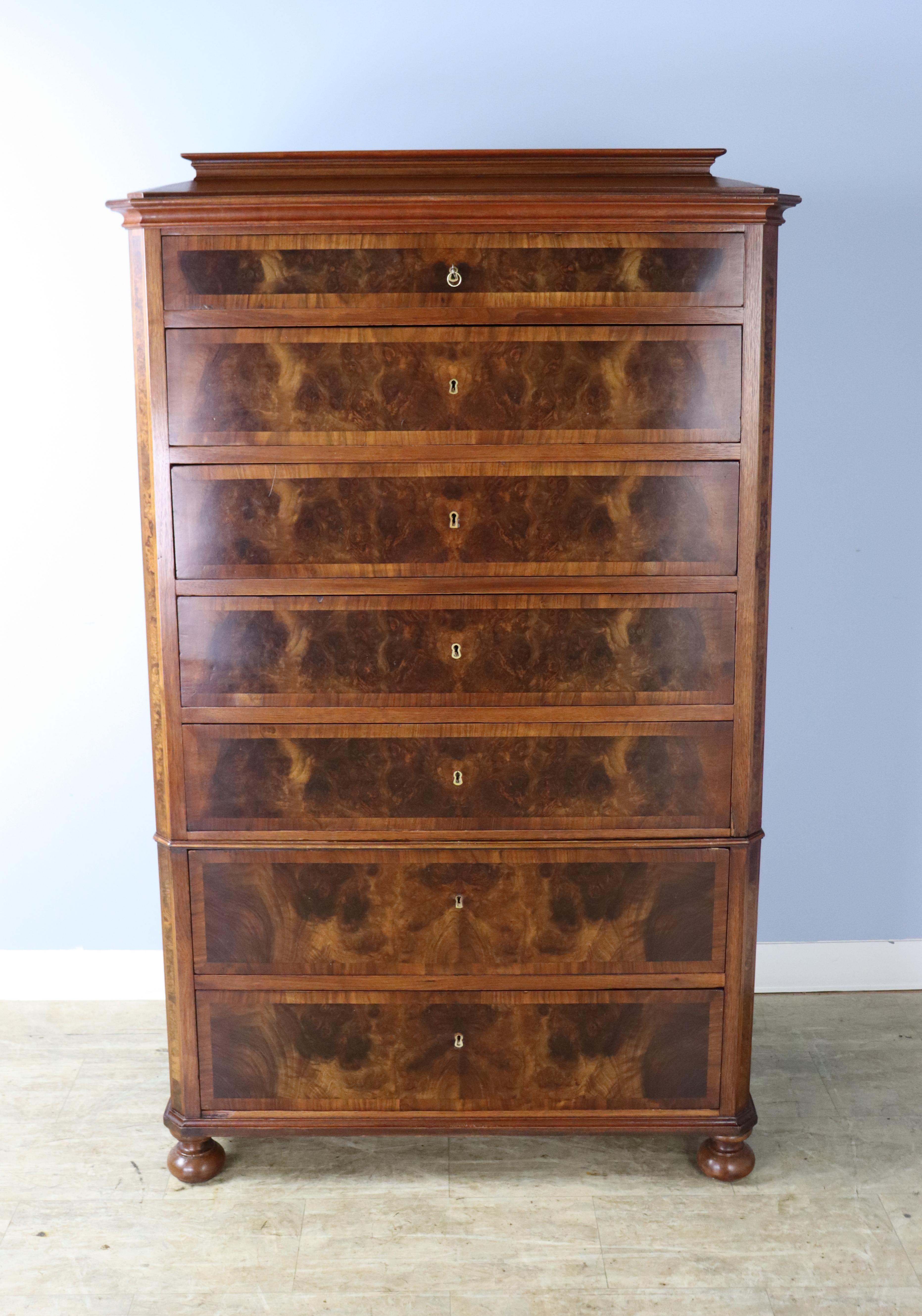 Like all semaniers, this chest has seven drawers, one for each day of the week. Built of glorious walnut with solid walnut burl accent panels. The stylized top can be removed for safe transport. Drawers open a single key, and run smoothly. Beautiful