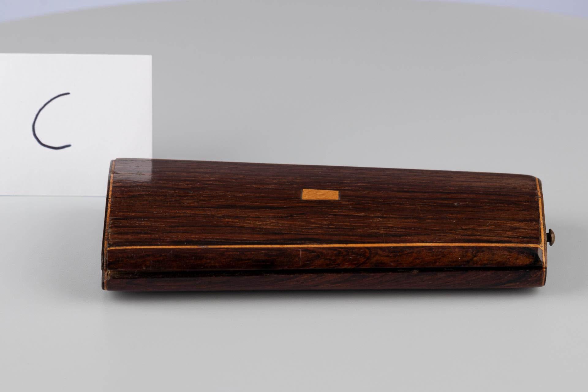 This dainty yet highly detailed sewing set was crafted in the late 19th century by skilled French artisans.

The case, also known as an étui, is made from walnut and has a tapering rectangular shape. Its smooth finish enhances the elegant feel of