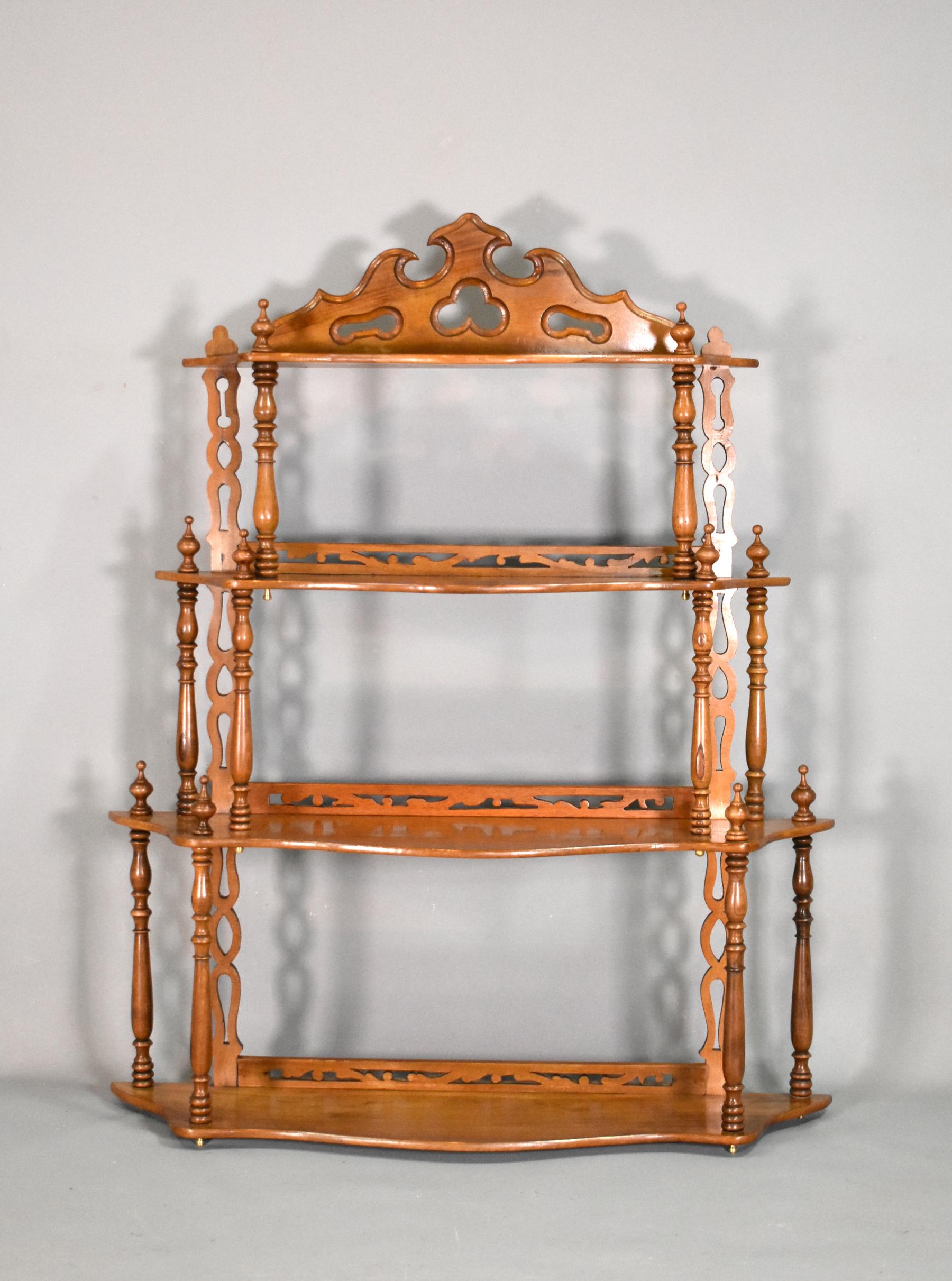 Antique French shelving unit 19th Century in Walnut Louis Philippe Style 

The Walnut Shelving Unit / Etagere features four serpentine shaped shelves in descending order of size. 

They all have a pierced rear back plate and pierced rear