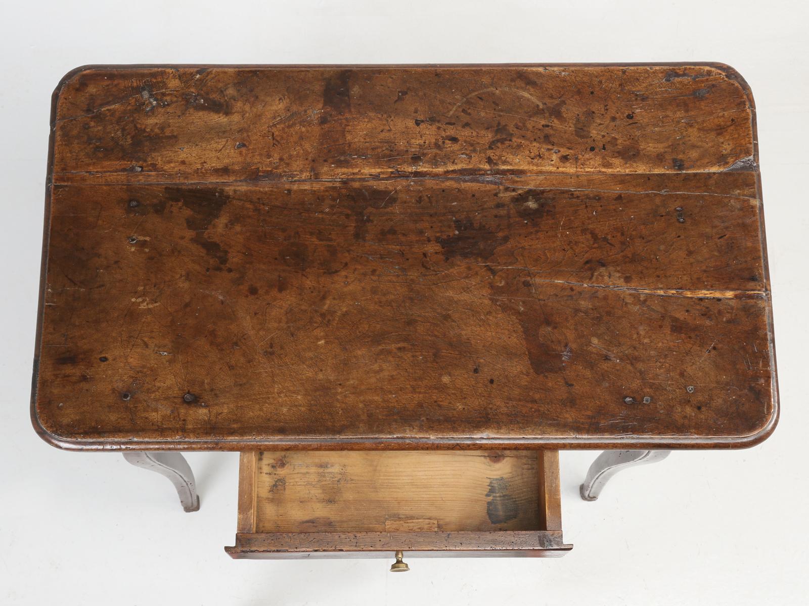 Antique French Louis XV style petite writing desk, which was made from solid walnut and after 200 years has obtained the most beautiful patina imaginable. The reason, the patination is so magical, is that it appears, that no one ever tried to