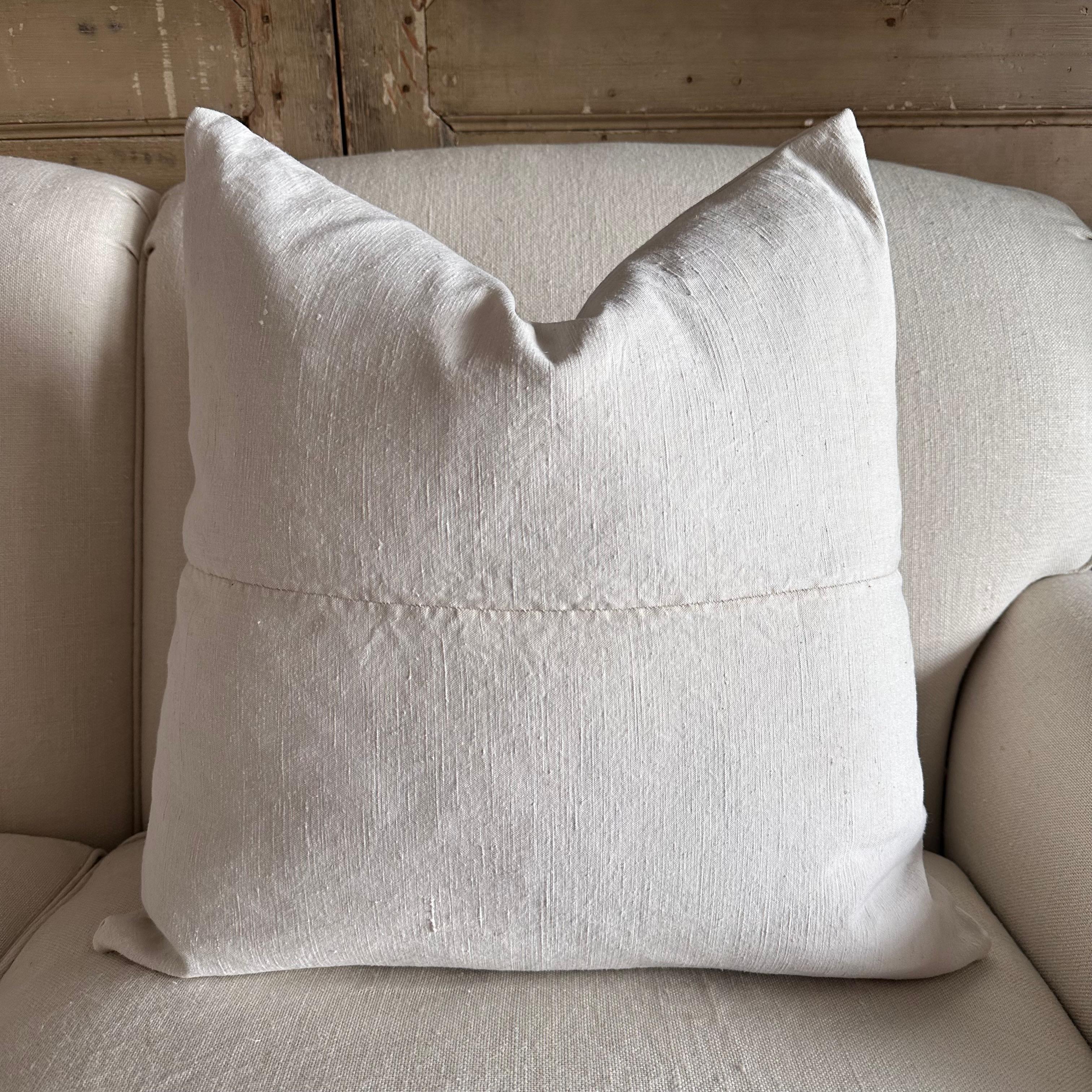 Antique French linen textile pillow with seam 0ff- white antique French linen textured grain sack pillow with original seam, backside is in a similar or same antique material.

Our linens are pre-washed ready for use. Please note that these fabrics