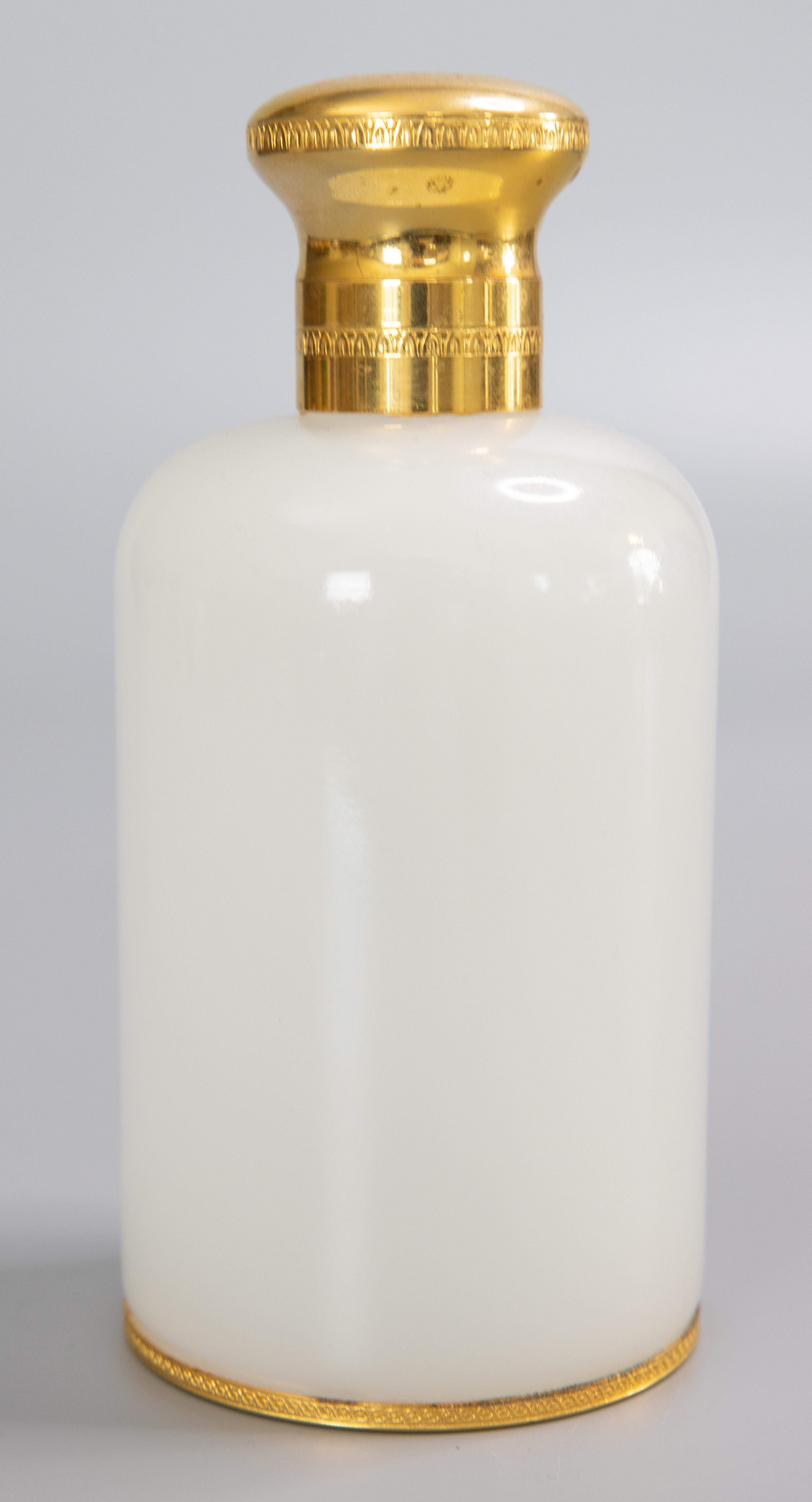 A lovely antique early 20th century French white opaline glass cologne or perfume scent bottle with ormolu mounts. This stunning scent bottle is a nice large Size and heavy, weighing 1 lb 4 oz, with a sleek stylish design, perfect for the modern
