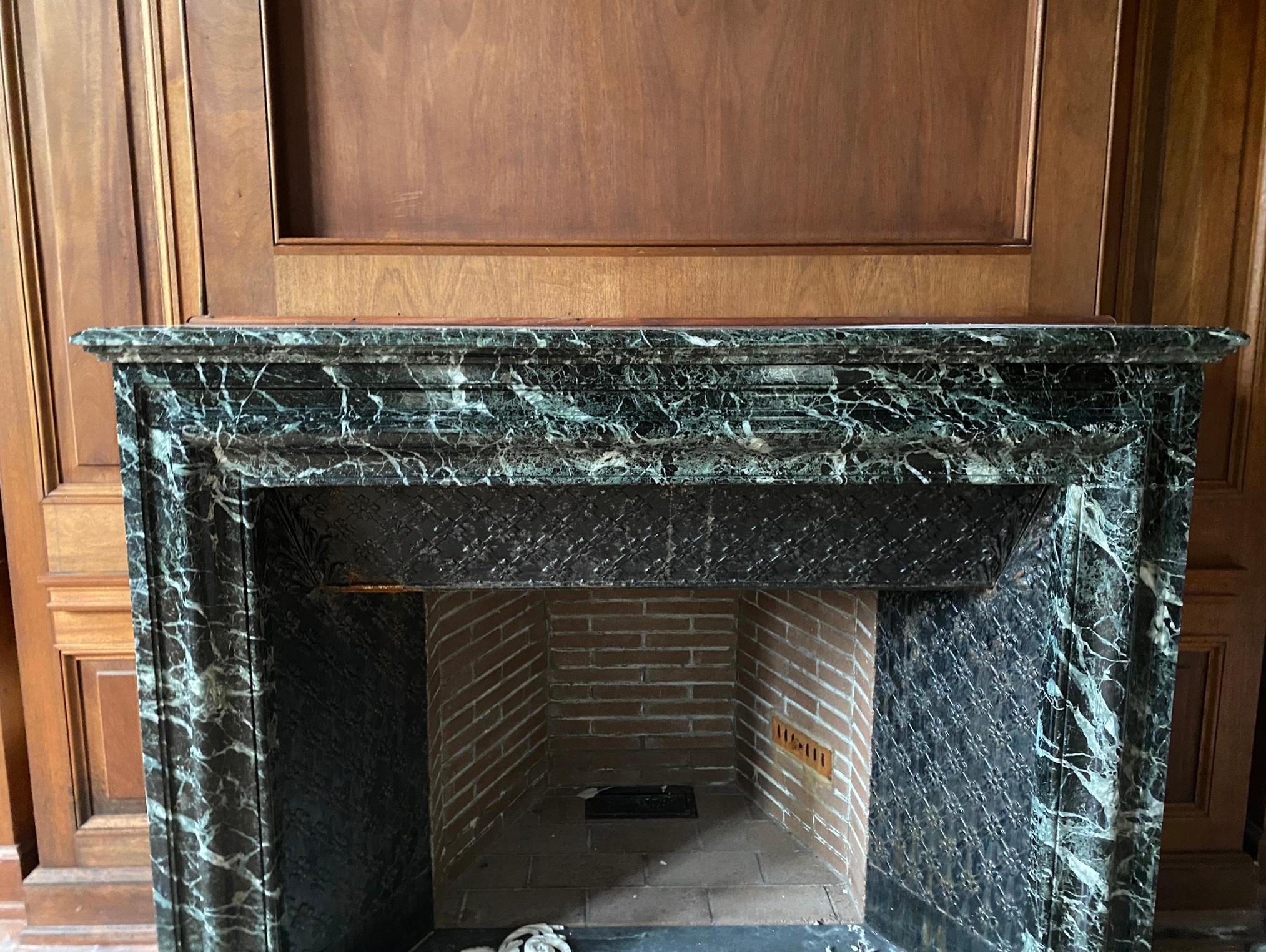 French dark green marble mantel with heavy white veining. This was retrieved from an estate located in Greenwich, Connecticut. Good condition with appropriate wear from age. One available. Please note, this item is located in one of our NYC