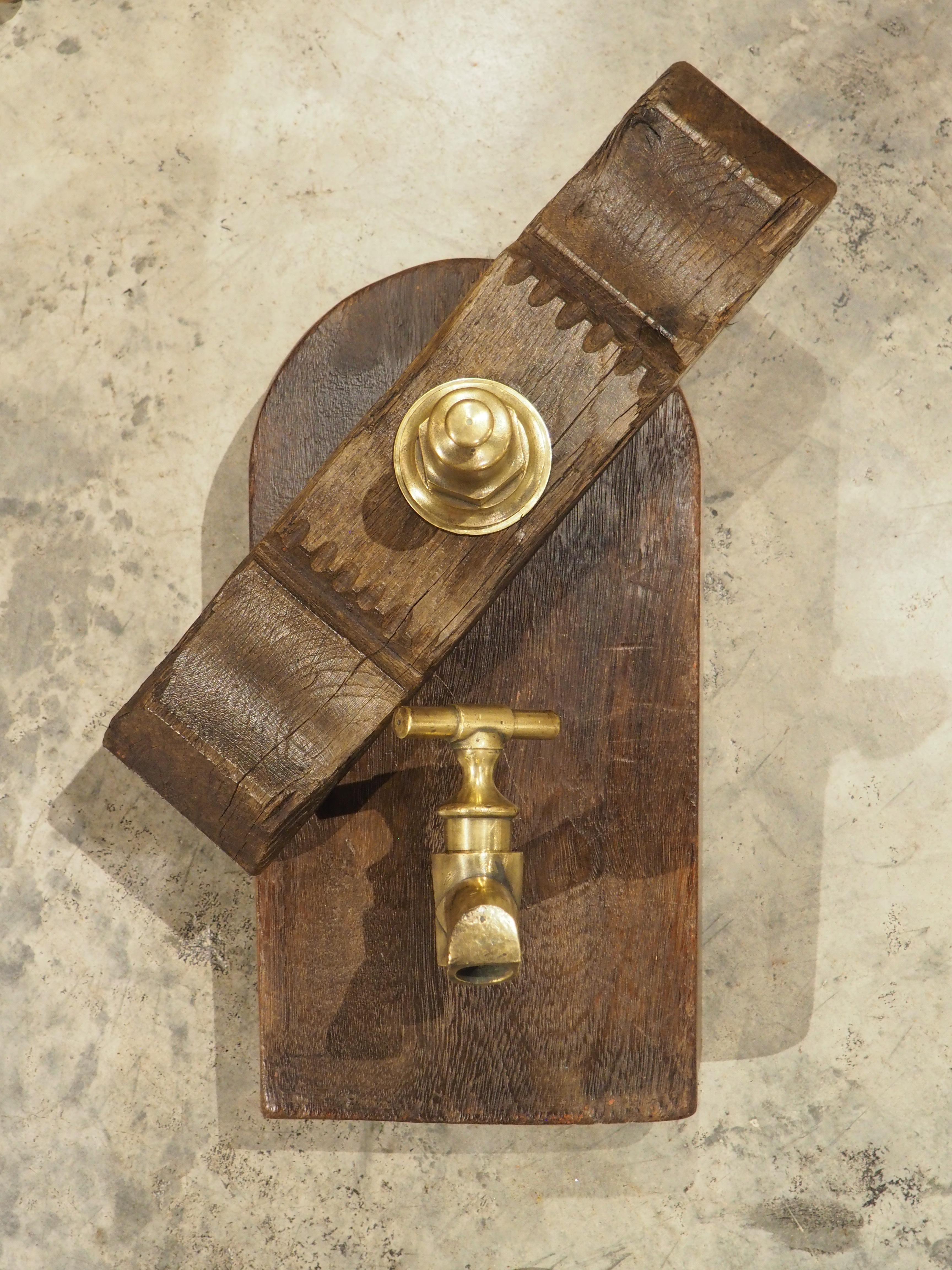 More information coming soon…

This hand-carved wooden door was once the access port to a wine barrel in a French vineyard around 1890.  The bronze spout is still contained within the door, just below a thick crossbar with the attaching pin.  This