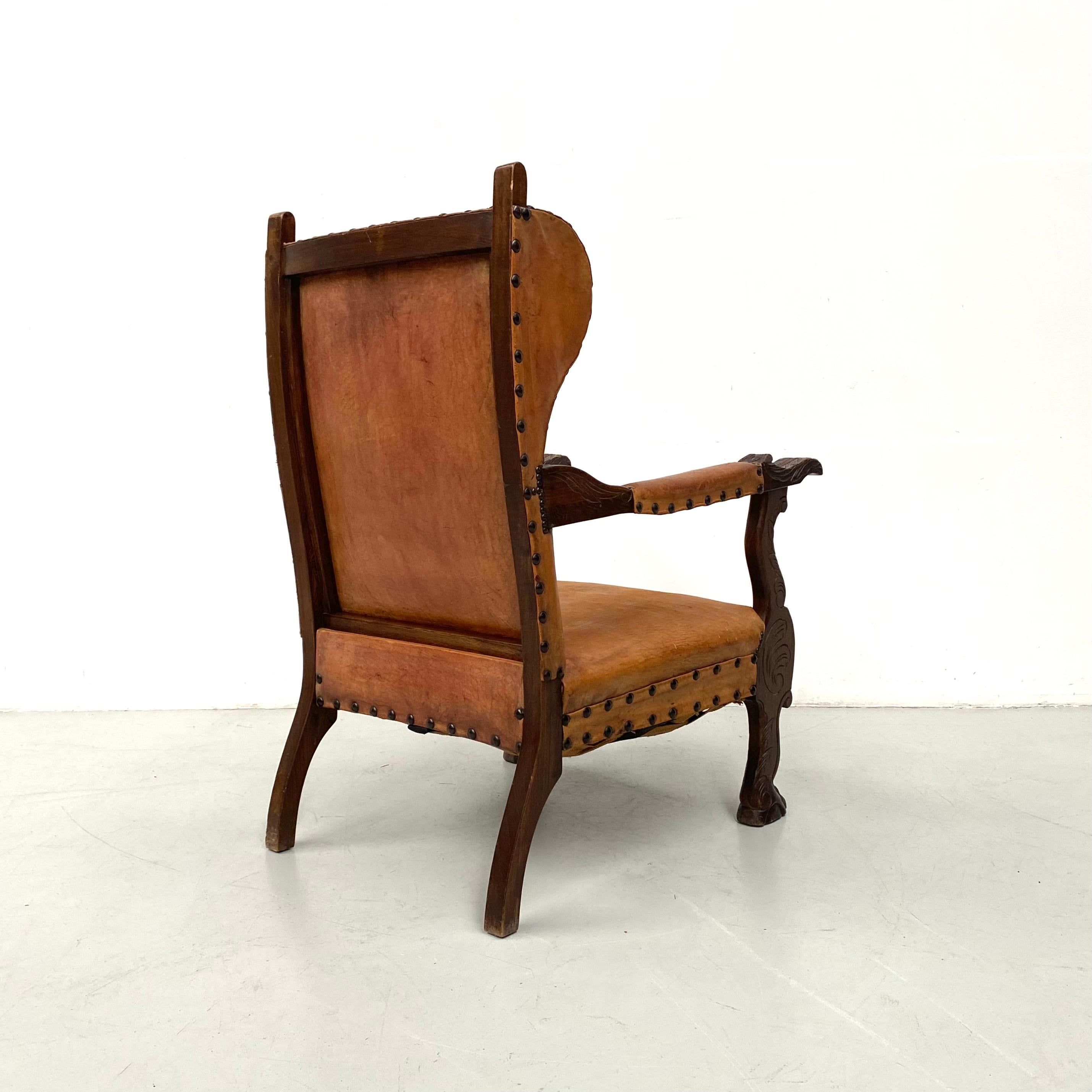 Antique French Wingchair in Cognac Leather with Carvings, 1920s. 4