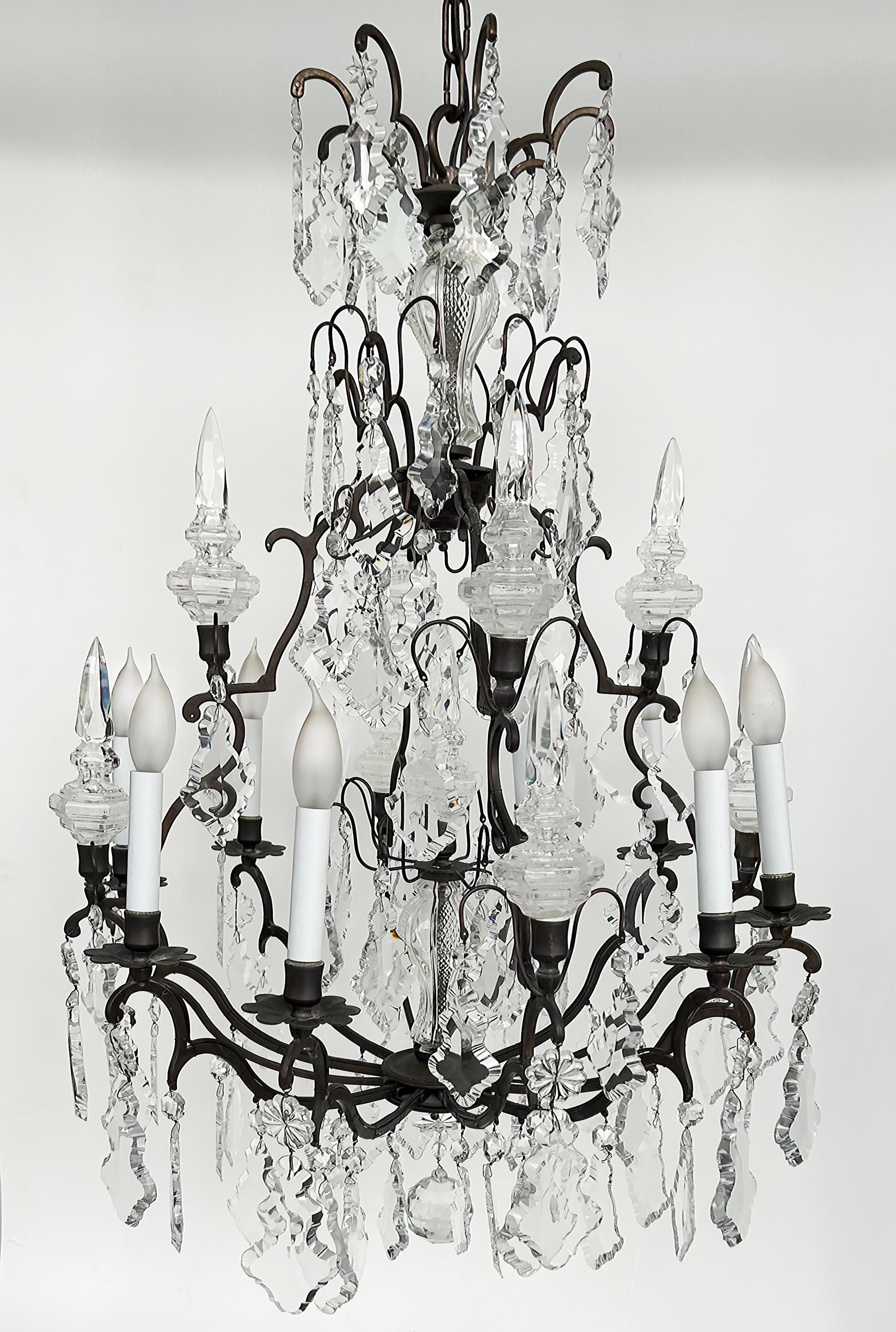 Antique French Louis XV Style Bronze Chandelier, Cut Crystal 

Offered for sale is an 19th century ornate and dense cut-crystal chandelier on a Louis XV-style bronze frame. The fixture has been electrified and is French-wired to accept candelabra