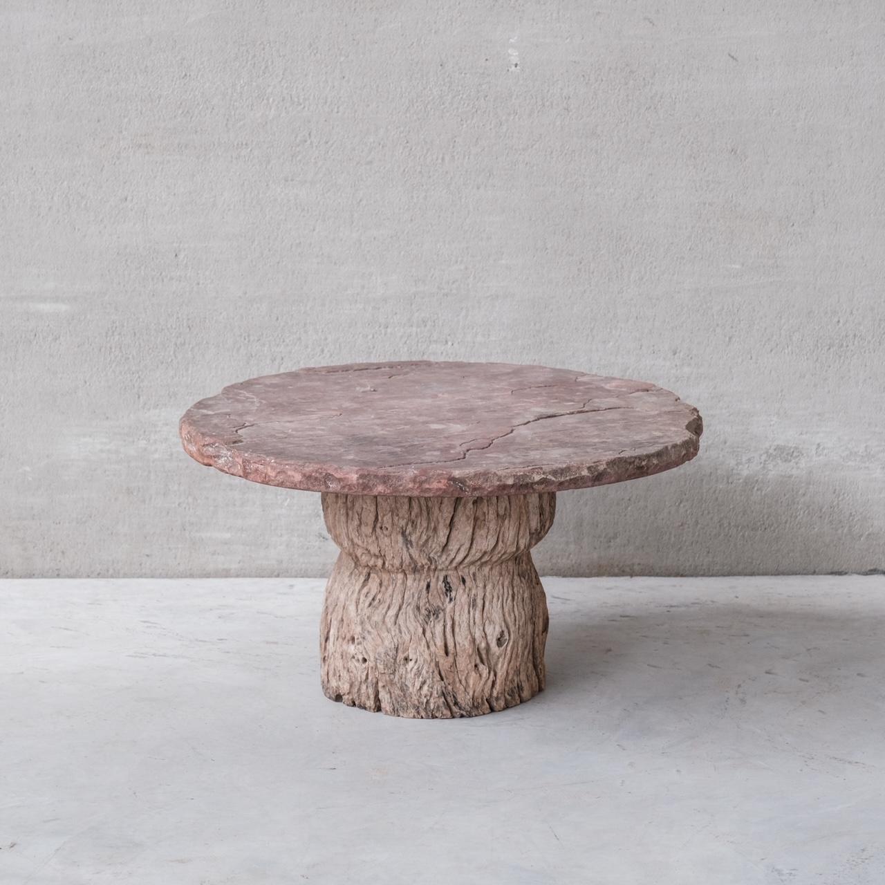 A stylish antique circular coffee table. 

France, c1910. 

A pairing of a wooden base with a primitive muted red stone top.

Good condition, some scuffs and wear commensurate with age. 

Location: Belgium Gallery.

Dimensions: 46 Height x