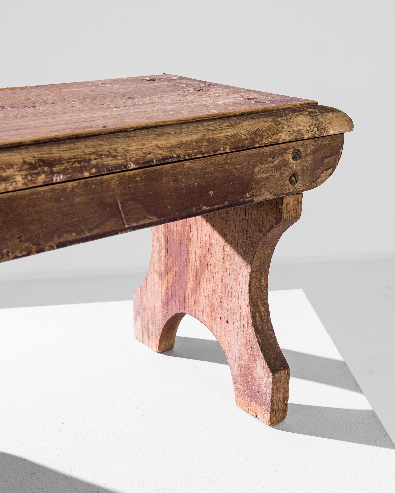 A wooden stool from France, produced circa 1900. A small stool for sedentary soloists. With a silhouette that looks like this antique was lifted from an old cathedral, this stool is the first step of a spiritual quest: feet planted, eyes closed,