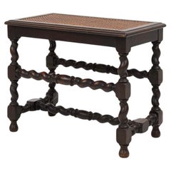 Antique French wooden stool with rattan top, ca. 1880