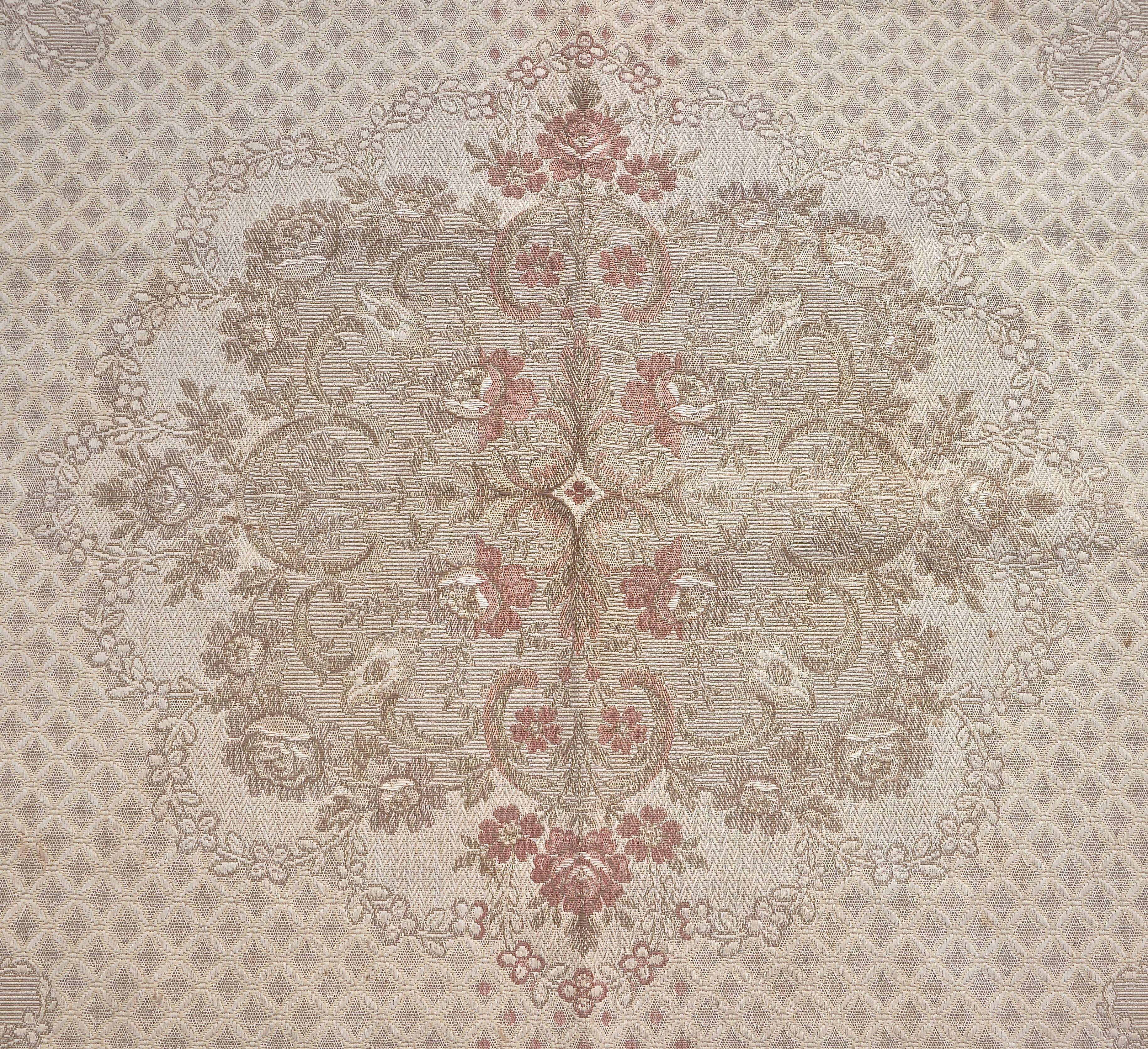 Beautiful antique French woven tapestry cotton rug or throw with a fringe edging. Measuring 165cm / 5.4 feet by 146cm / 4.8 feet, not including the fringe. Featuring a lovely floral design in pastel shades of coffee, cream and pink. It is in good