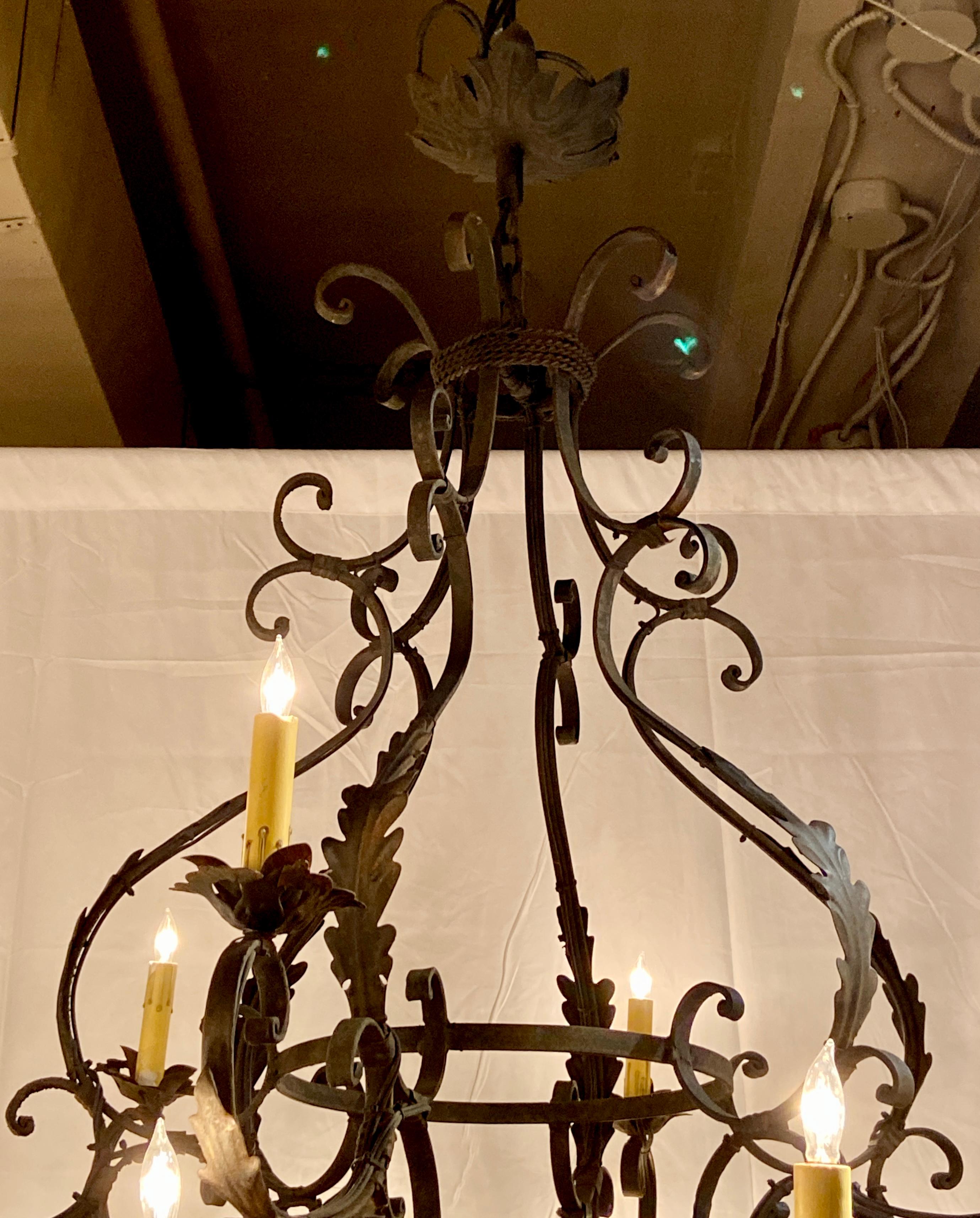A nicely rendered wrought iron chandelier with plenty of light (18 lights) and appealing detail with the leaf motif and grape clusters.