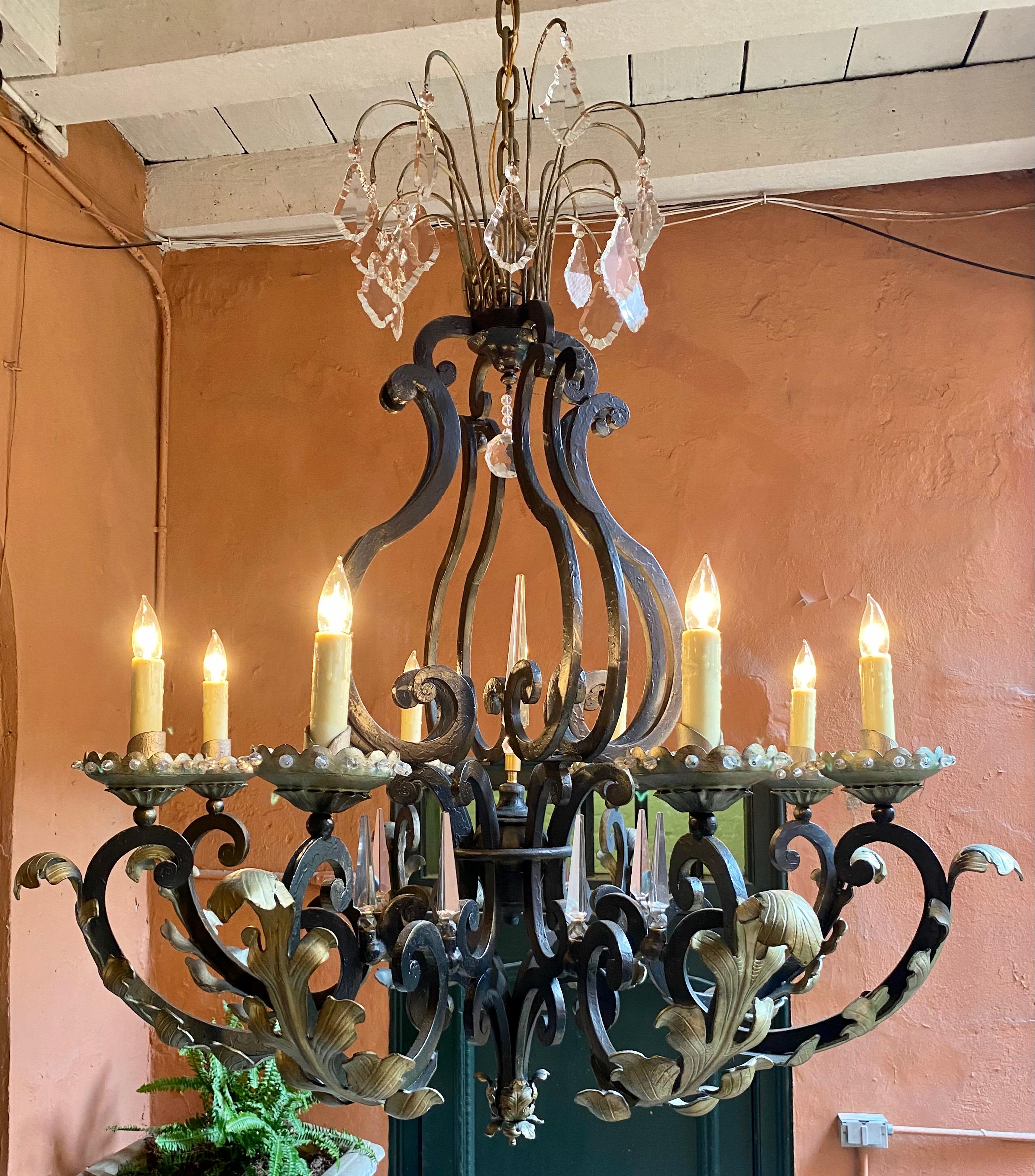 Exceptionally large antique French wrought iron and crystal chandelier, Circa 1900.