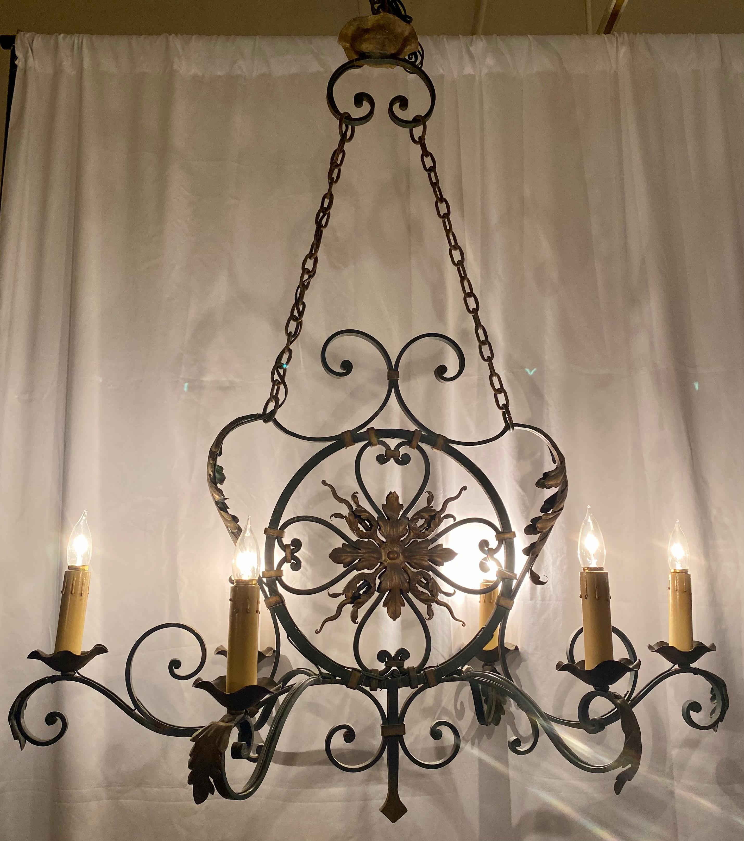 Antique French wrought iron chandelier.

 