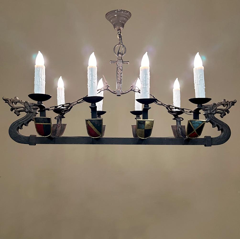Antique French Wrought Iron Viking Long Boat Chandelier will make an eye-catching Old World statement in any room!  The solid wrought iron fixture resembles a Viking Long Boat, which vessels were used to raid the entire European continent and spread