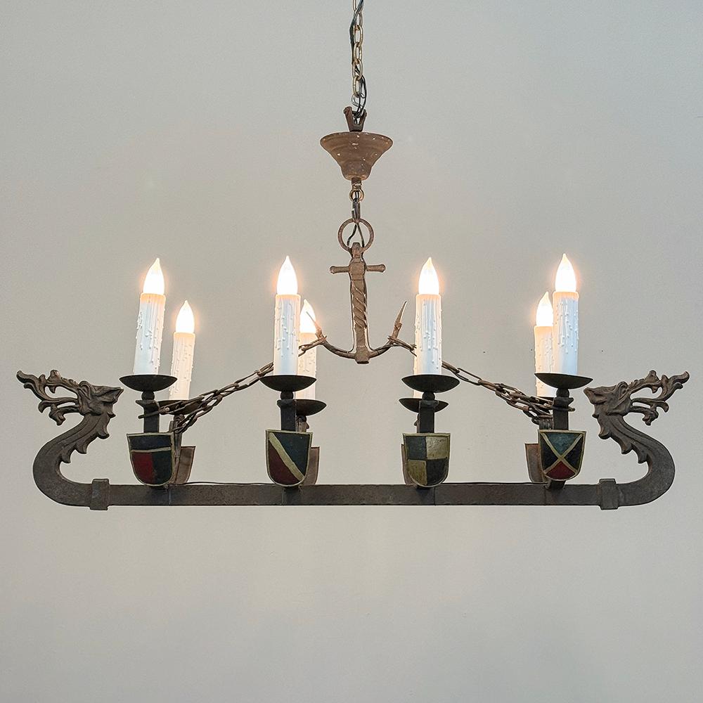 Antique French Wrought Iron Viking Long Boat Chandelier will make an eye-catching Old World statement in any room!  The solid wrought iron fixture resembles a Viking Long Boat, which vessels were used to raid the entire European continent and spread