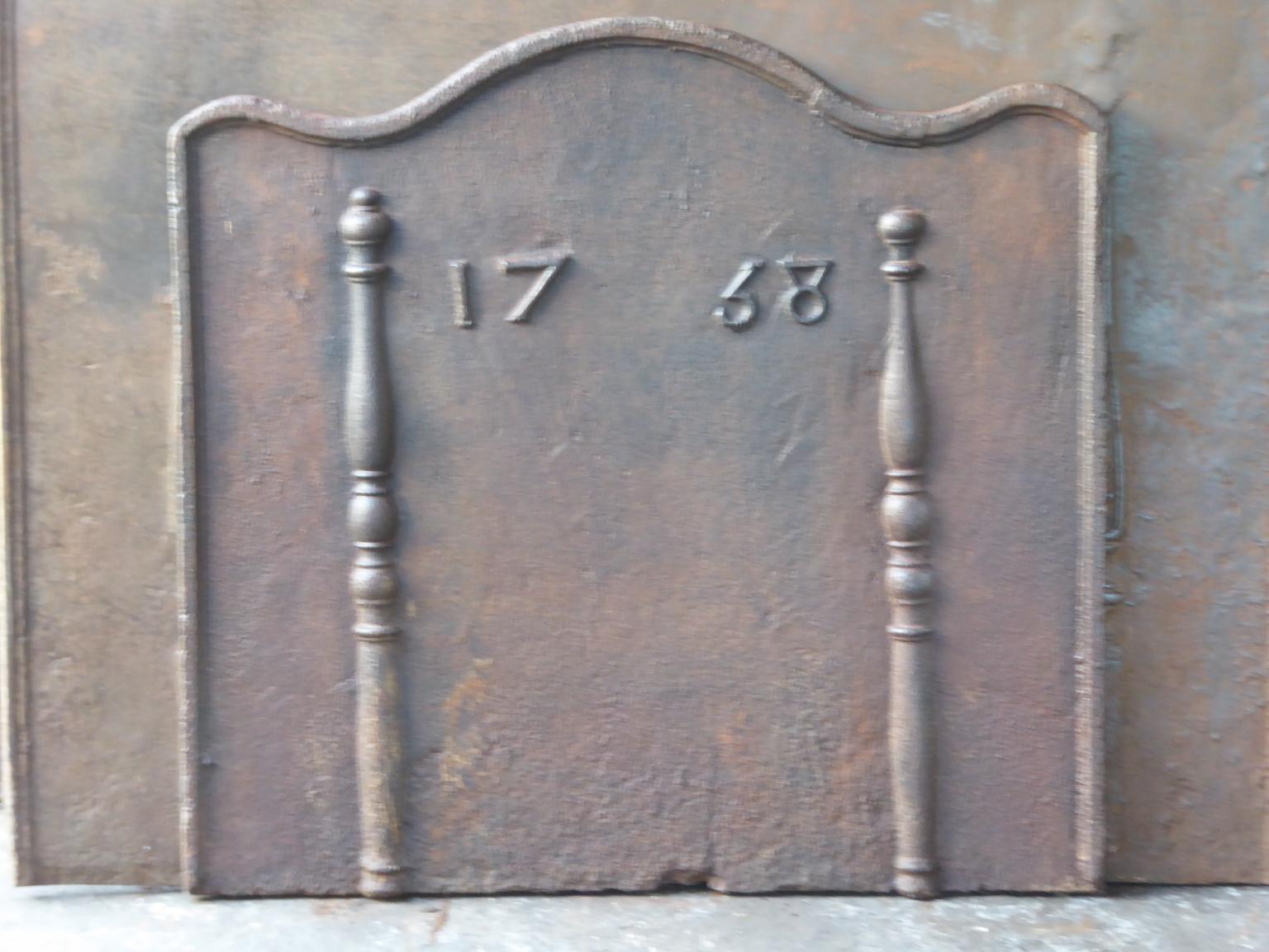 18th century French Louis XV fireback. The date of production, 1768, is cast in the fireback. The pillars refer to the club of Hercules and symbolize strength and the unknown.

The fireback is made of cast iron and has a natural brown patina. Upon