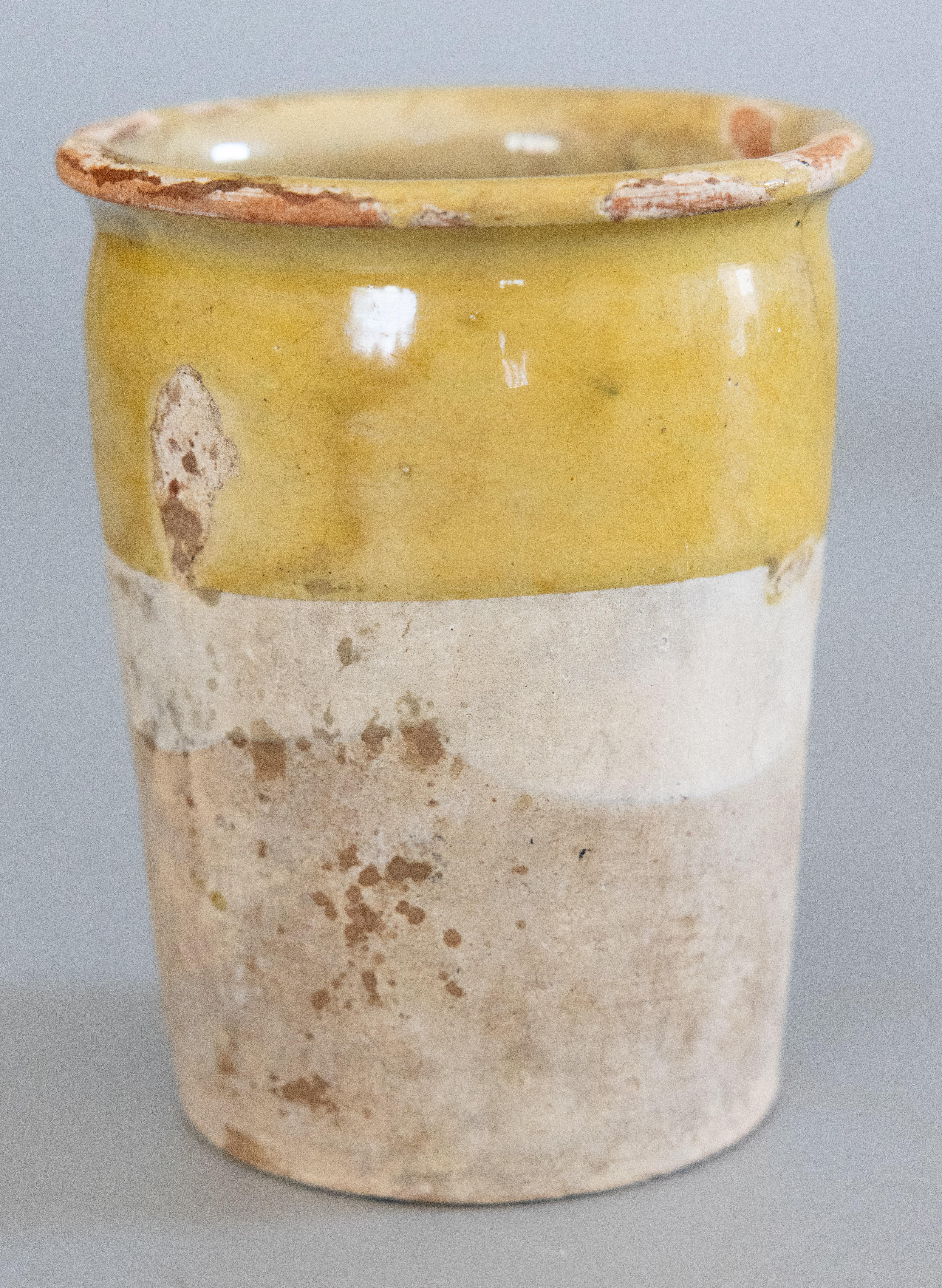 A charming 19th century French confit pot or crock with a wonderful yellow glaze. Sourced from the South of France, Castelnaudary. These jars were used for storing and preserving cooked meat, and would be beautiful today with a bouquet of flowers or