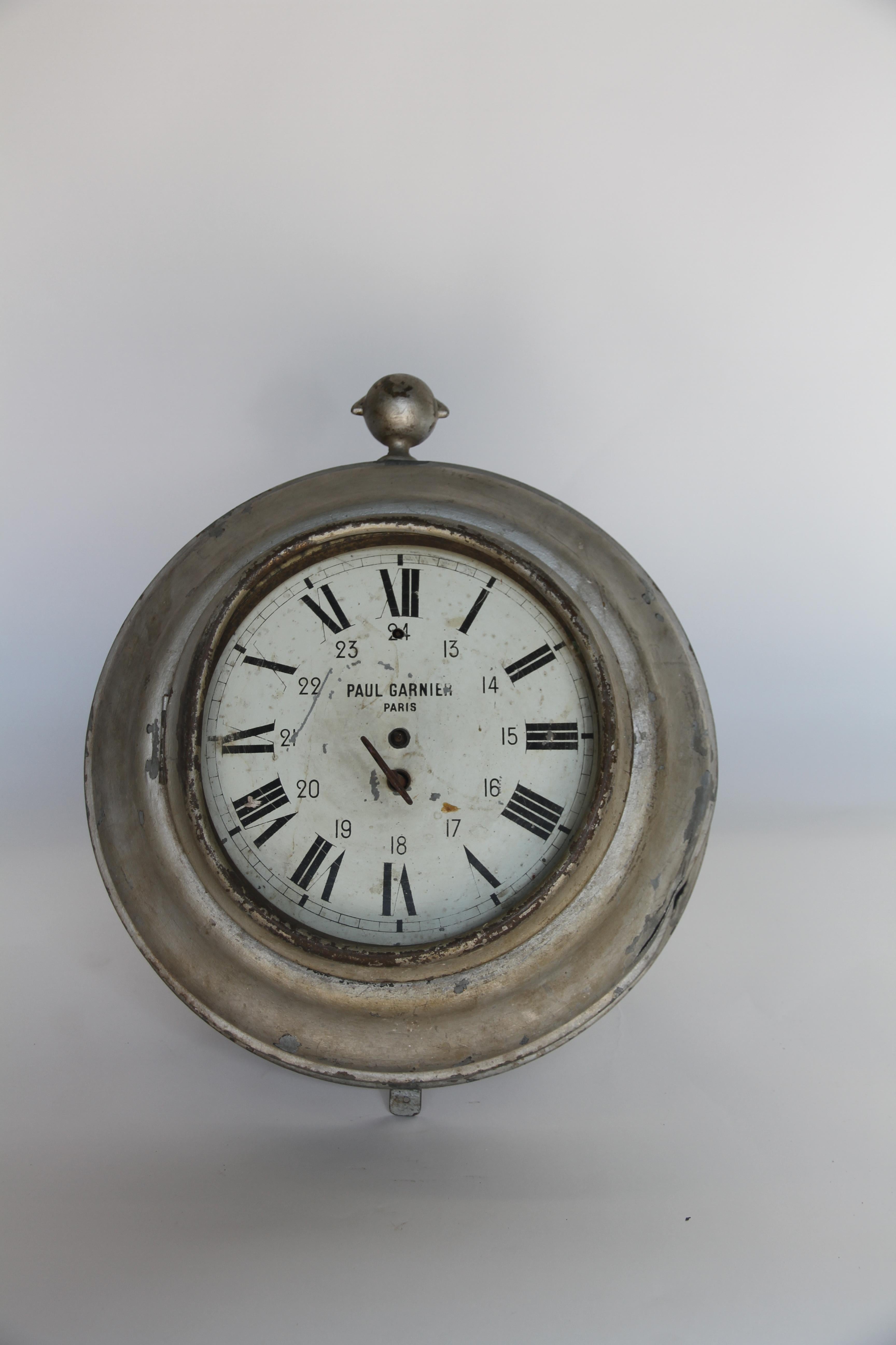 An antique French wall clock. Made of zinc the 9.75
