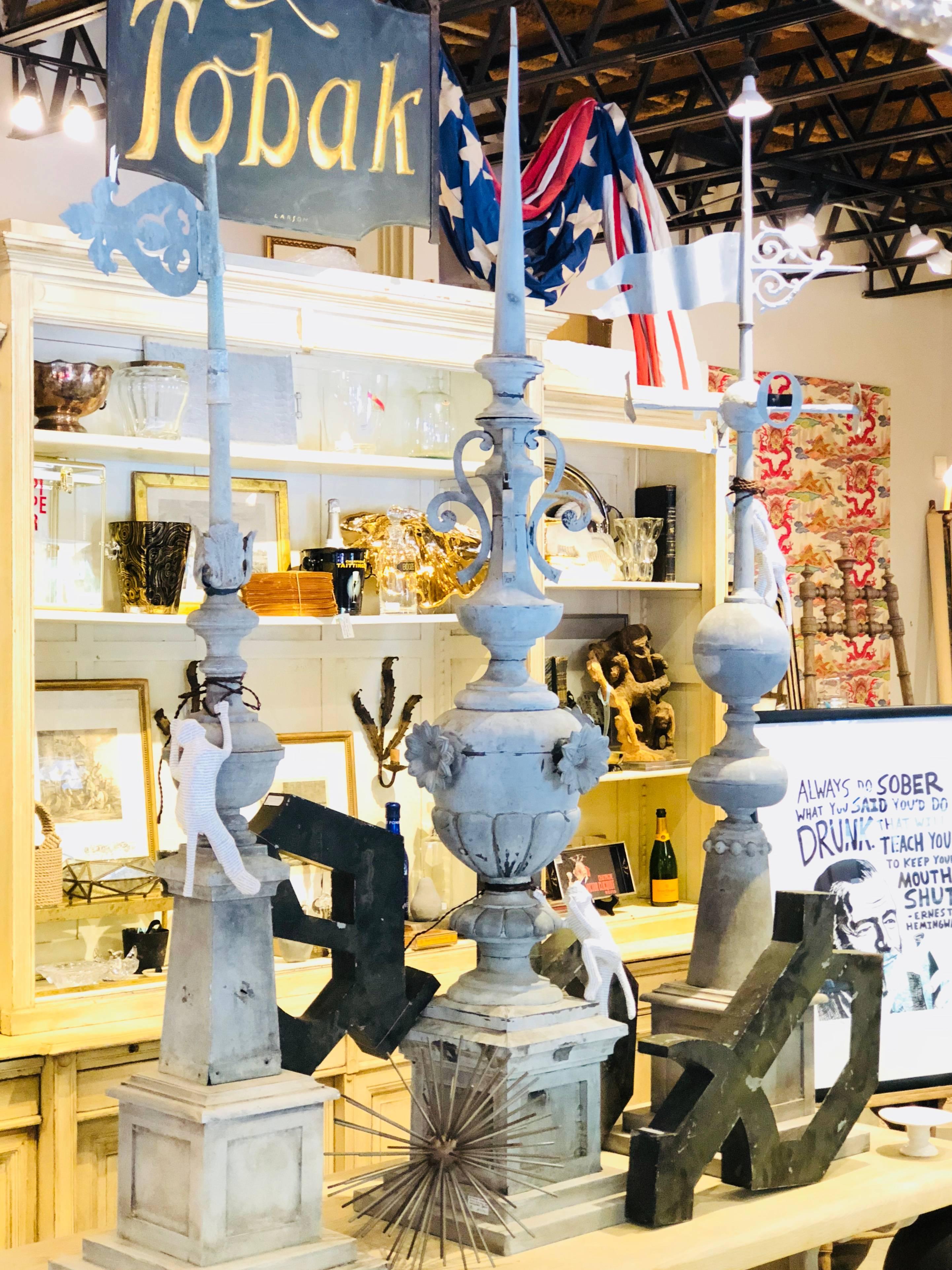 We sourced a small grouping of antique French finials crafted from zinc and created custom bases for them to allow for artful display inside or out. This stunning piece is the largest of the three we have and features wonderful details like the