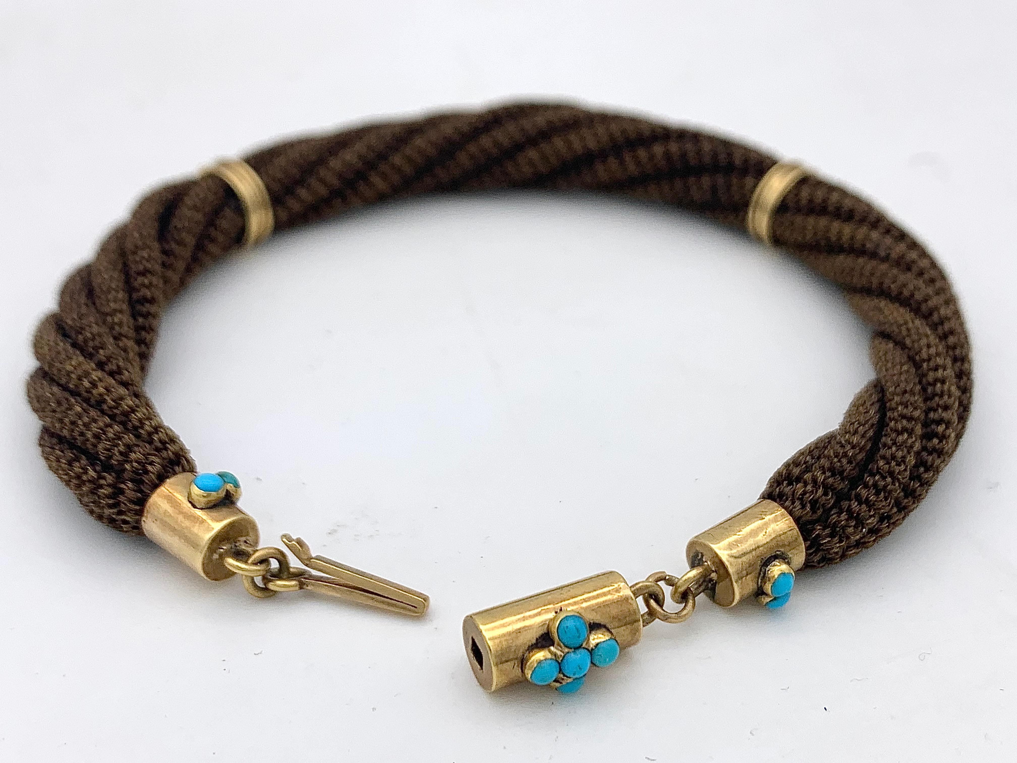 This handcrafted bracelet was intended as a sentimental token of friendship. The perfectly woven brown hair bracelet is made up out of six individually woven thin ropes. The bracelet has a wonderful elasticity. The clasp is made out of 14 karat