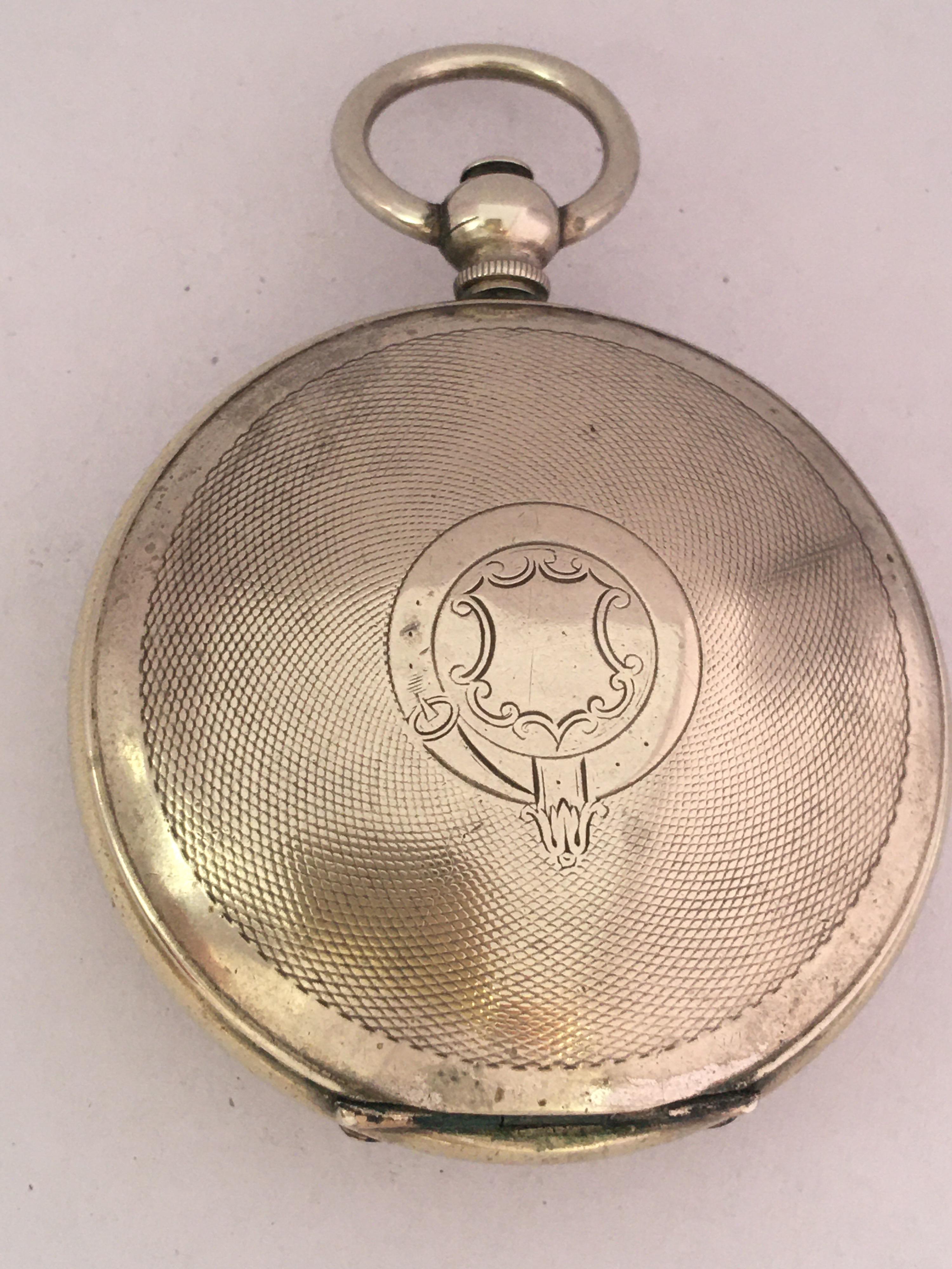 Nickel cased hunter pocket watch for the Turkish market, unsigned movement, the dial with Turkish numerals and blued steel hands, engine turned case, 54mm. 

This watch is in good working condition and it is ticking well. Visible signs of ageing and