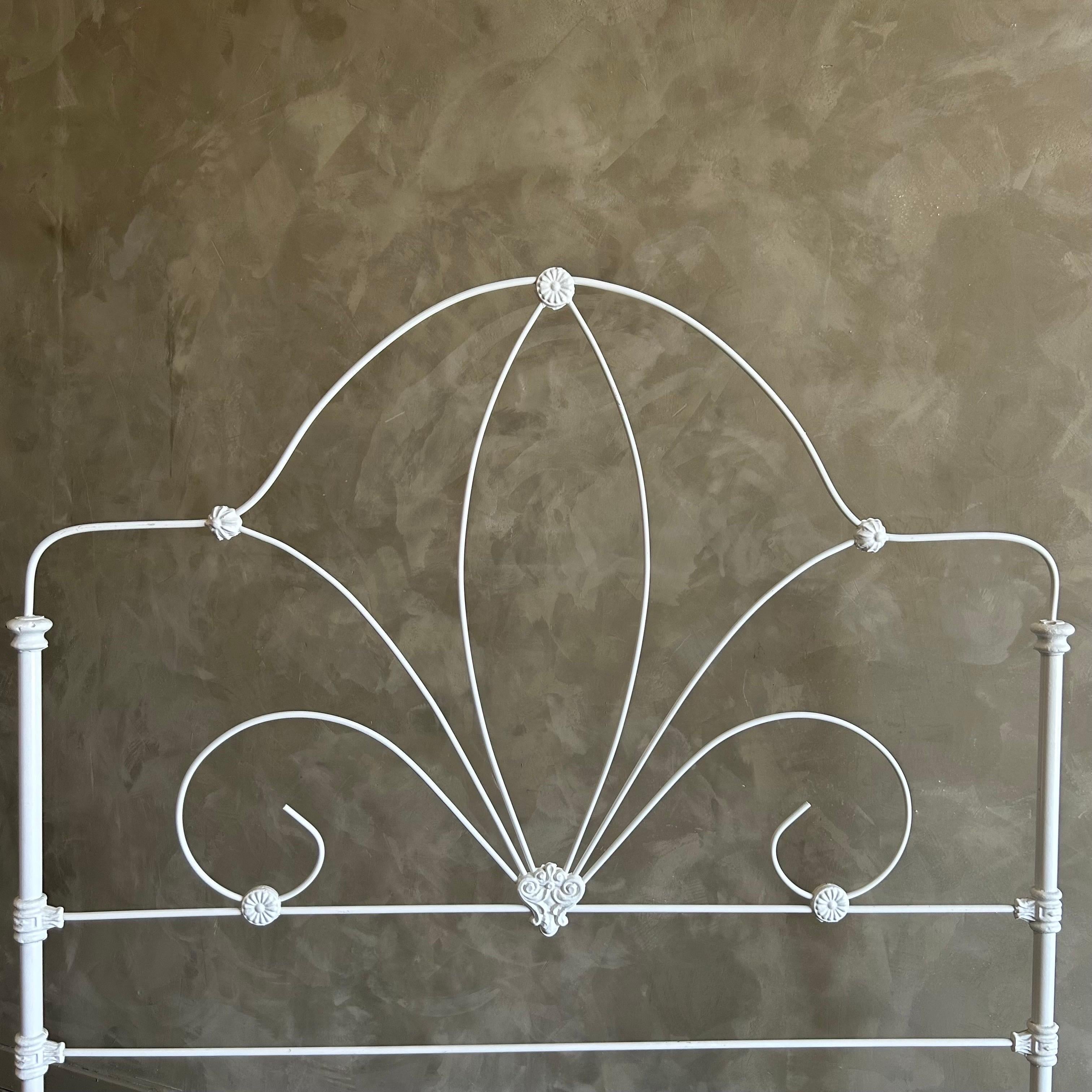 Antique Iron bed full size 54”w x 78”d x 64”h
Footboard: 51”h
White painted Finish with original wheels, can be removed if wanted.
Original side rails that drop into place, no hardware needed, this bed is structurally sound and sturdy when