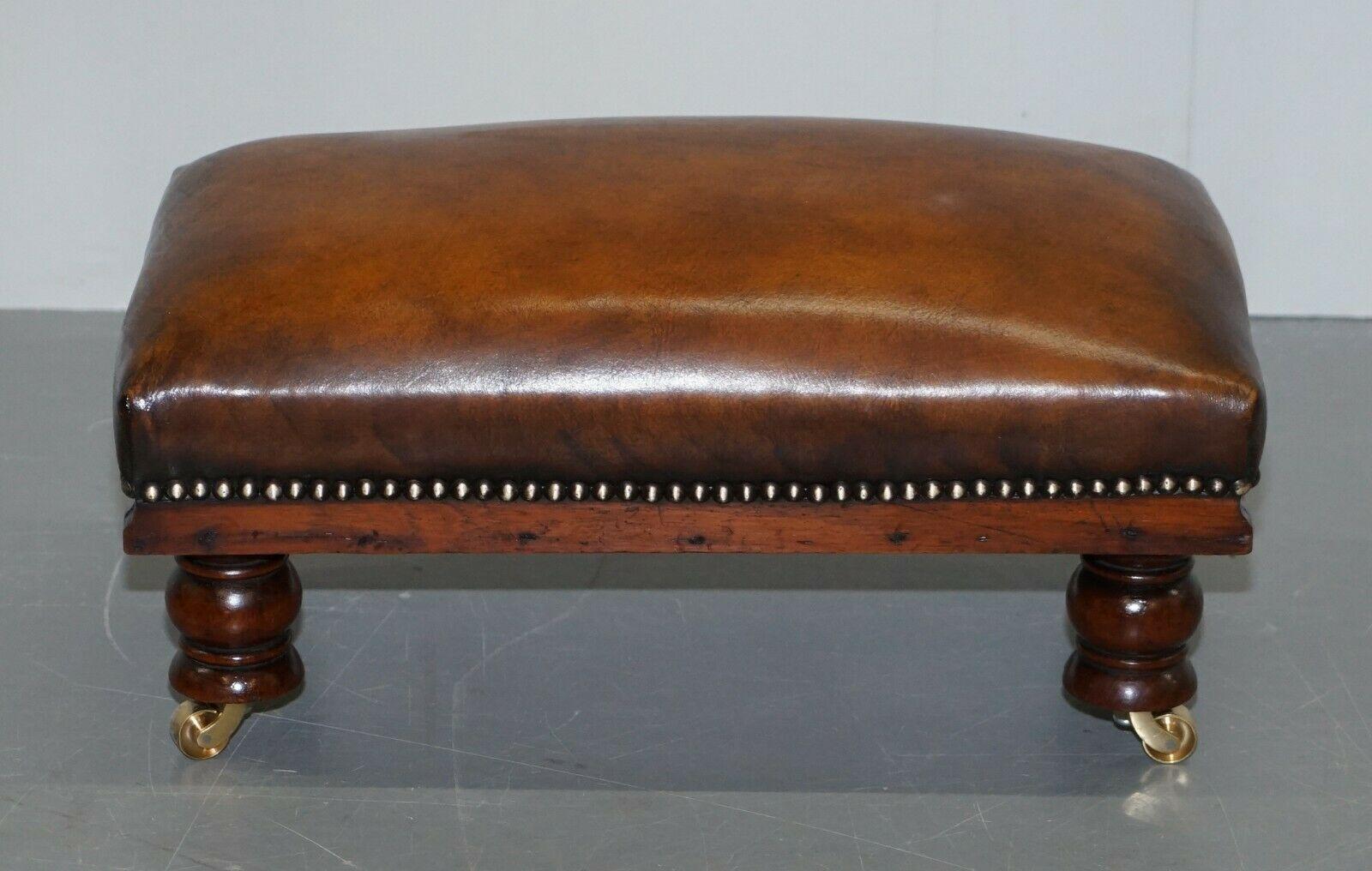 We are delighted to offer for sale this sublime antique fully restored whisky brown leather footstool

A very good looking and comfortable little stool, the leather has been stripped back and hand dyed this glorious whisky brown colour, the frame