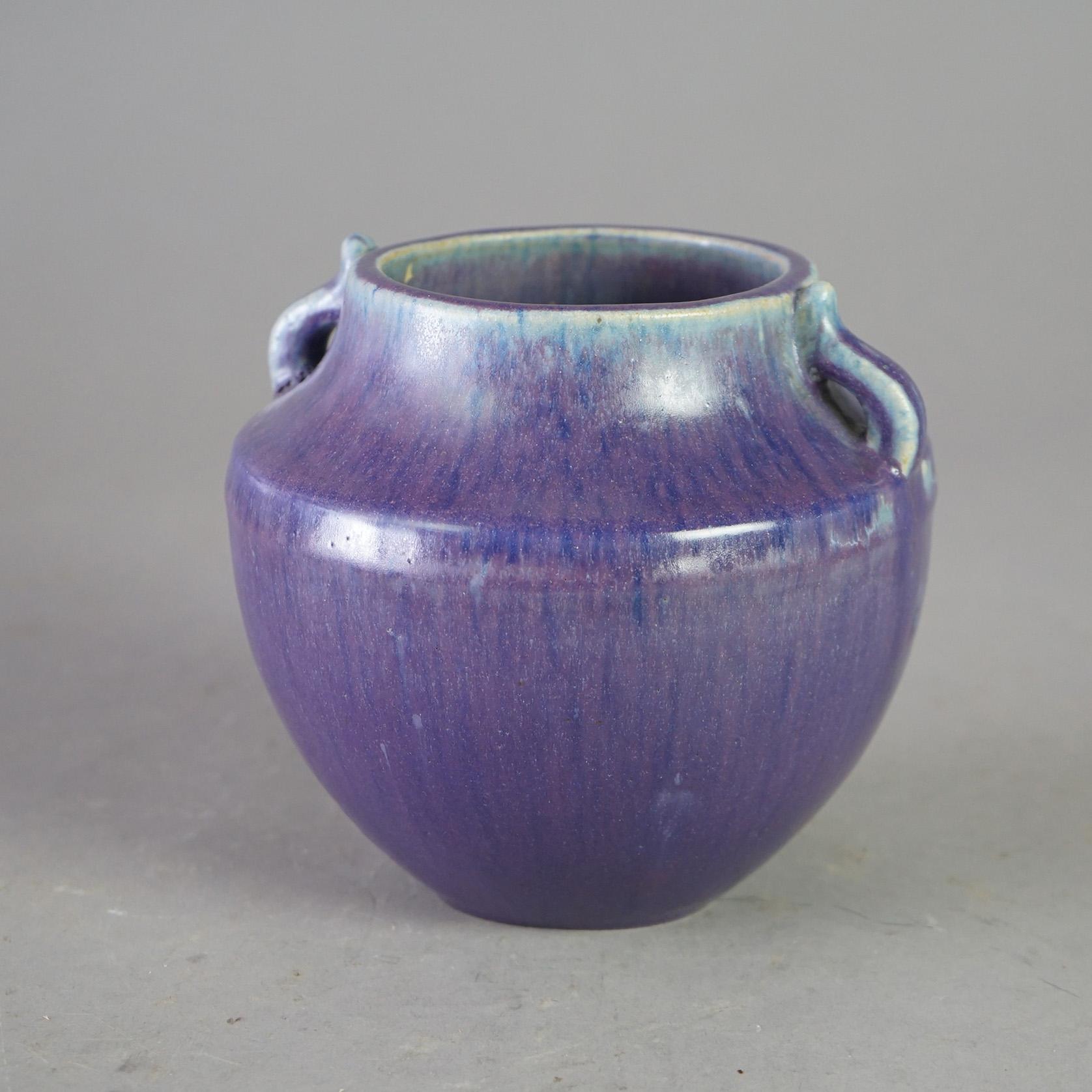 An antique vase by Fulper offers art pottery construction with double handles, glazing and maker mark on the base as photographed, c1920

Measures - 6