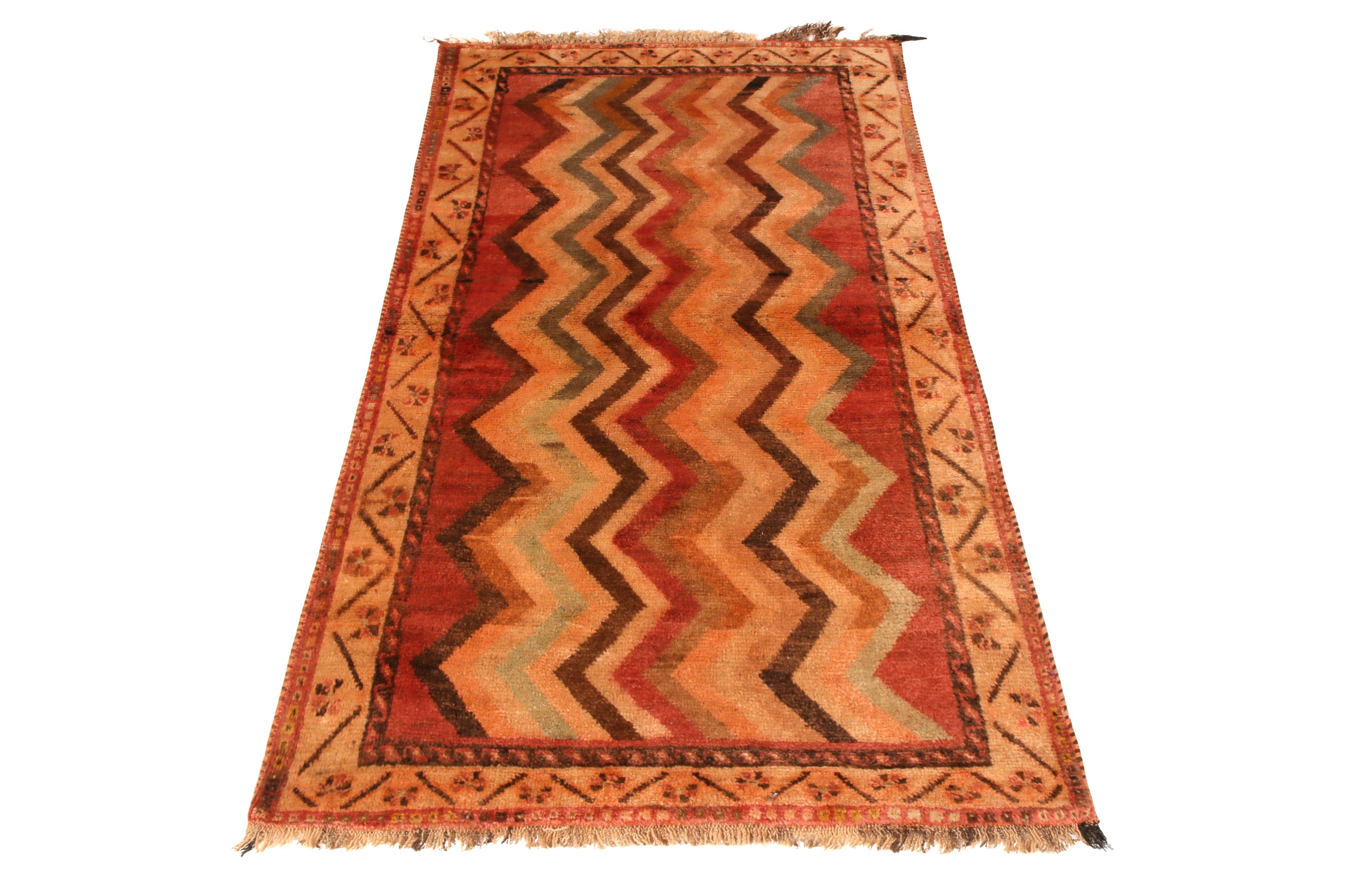 Made with hand knotted wool and originating between 1910-1920, this antique Gabbeh Persian rug celebrates the individuality of each piece in this respected lineage of handmade rugs, recapturing the Classic all-over chevron pattern renowned among