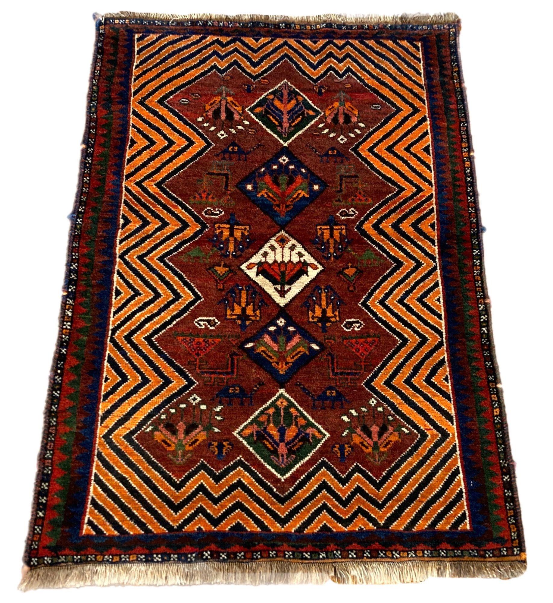 A lovely antique Gabbeh rug, hand woven by the nomadic Qashqai tribe circa 1920. The design features 5 medallions on a rich terracotta field. Some interesting characters including peacocks and camels and a great example of tribal art!
Size: 1.58m x
