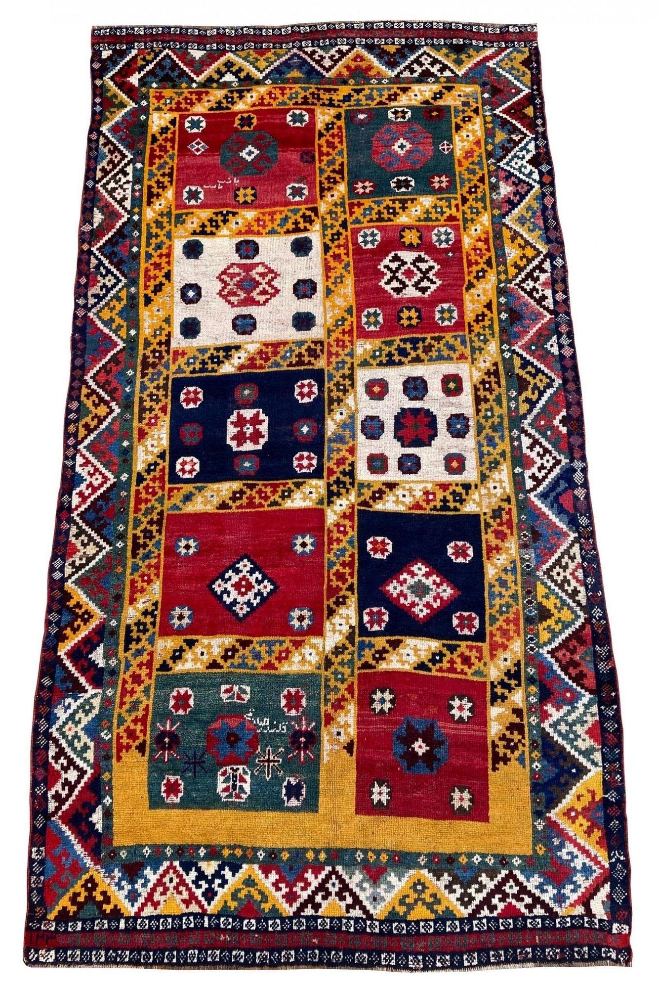 An exceptional antique Gabbeh rug, handwoven by the nomadic Qashqai tribe circa 1900 with a geometrical design on a saffron yellow field and great secondary colours. Signed by the weaver, Galander Sed Gir. There are a couple of interesting elements