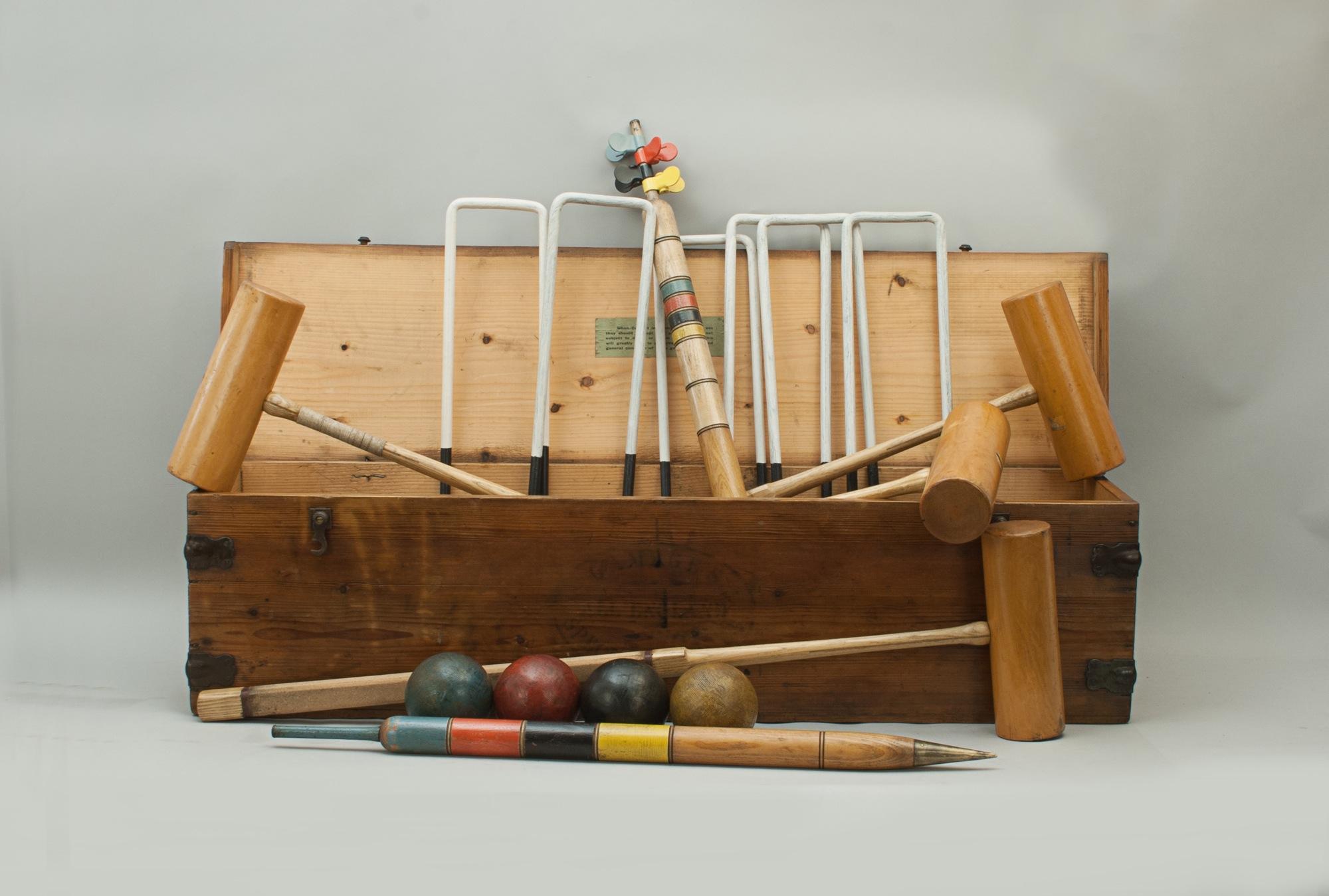 Vintage A.W. Gamage Ltd. Croquet Set.
A high quality A.W. Gamage Ltd, London, croquet set in its original polished pine box. The set comes with four box wood croquet mallets with ebony guide lines on the tops of the heads, the remains of an 'A.W.
