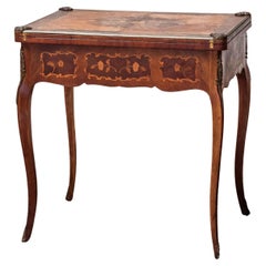 Antique game table decorated with mareketeria