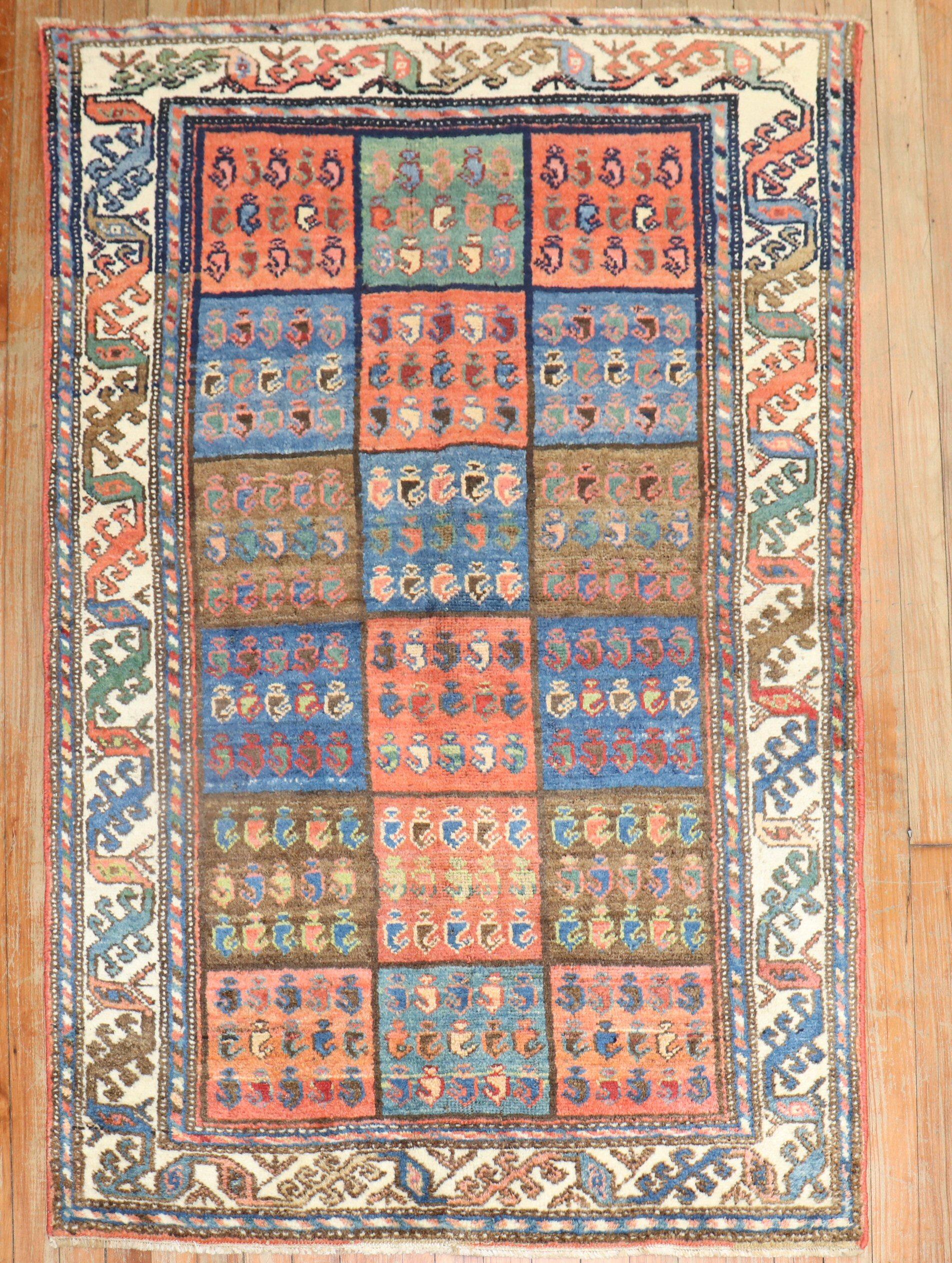 A circa 1940 traditional colorful Persian Bakhtiari scatter size rug with a garden box design

Measures: 3'3