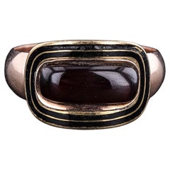 Antique Garnet and Enamel Mourning Ring of 10k Gold