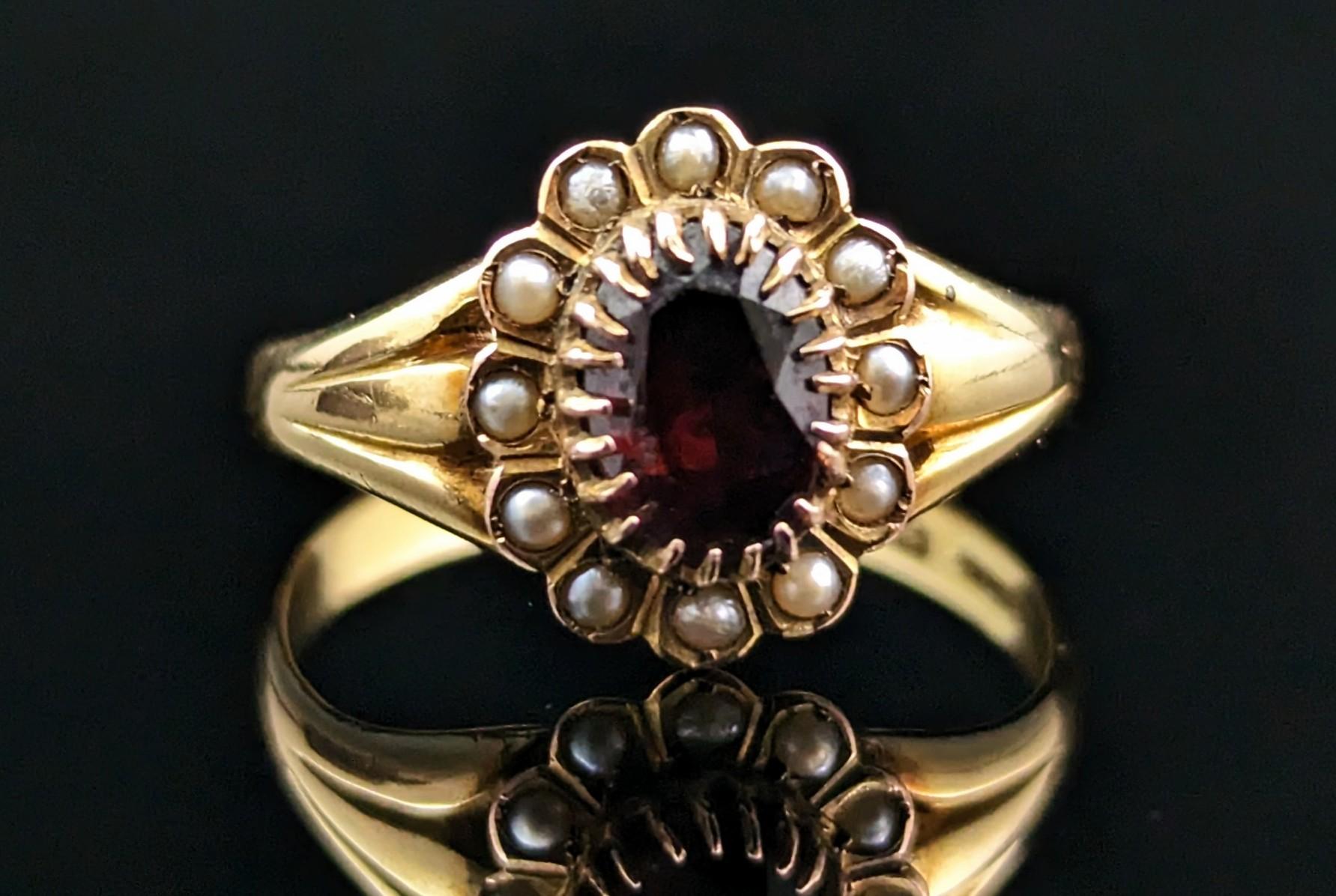 This gorgeous antique Garnet and seed pearl cluster ring is just the ticket if you are looking for a new addition to your antique ring collection or a special gift.

She is crafted in solid buttery 18kt yellow gold with a rich red, faceted oval cut