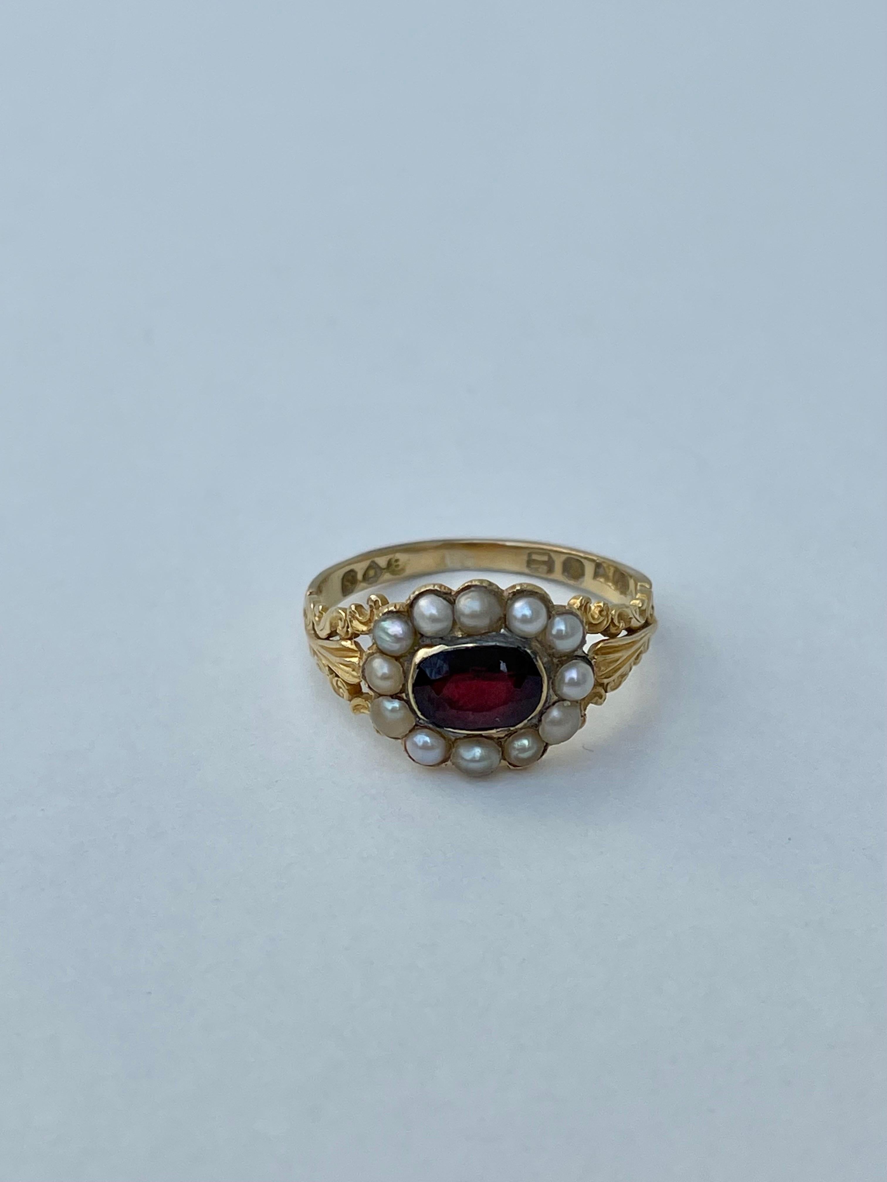 Antique Garnet and Pearl Halo 18ct Yellow Gold Ring 

the most prettiest detailed antique ring, gorgeous detailed shoulders 

The item comes without the box in the photos but will be presented in a gembank1973 gift box

Measurements: weight 3.74g,