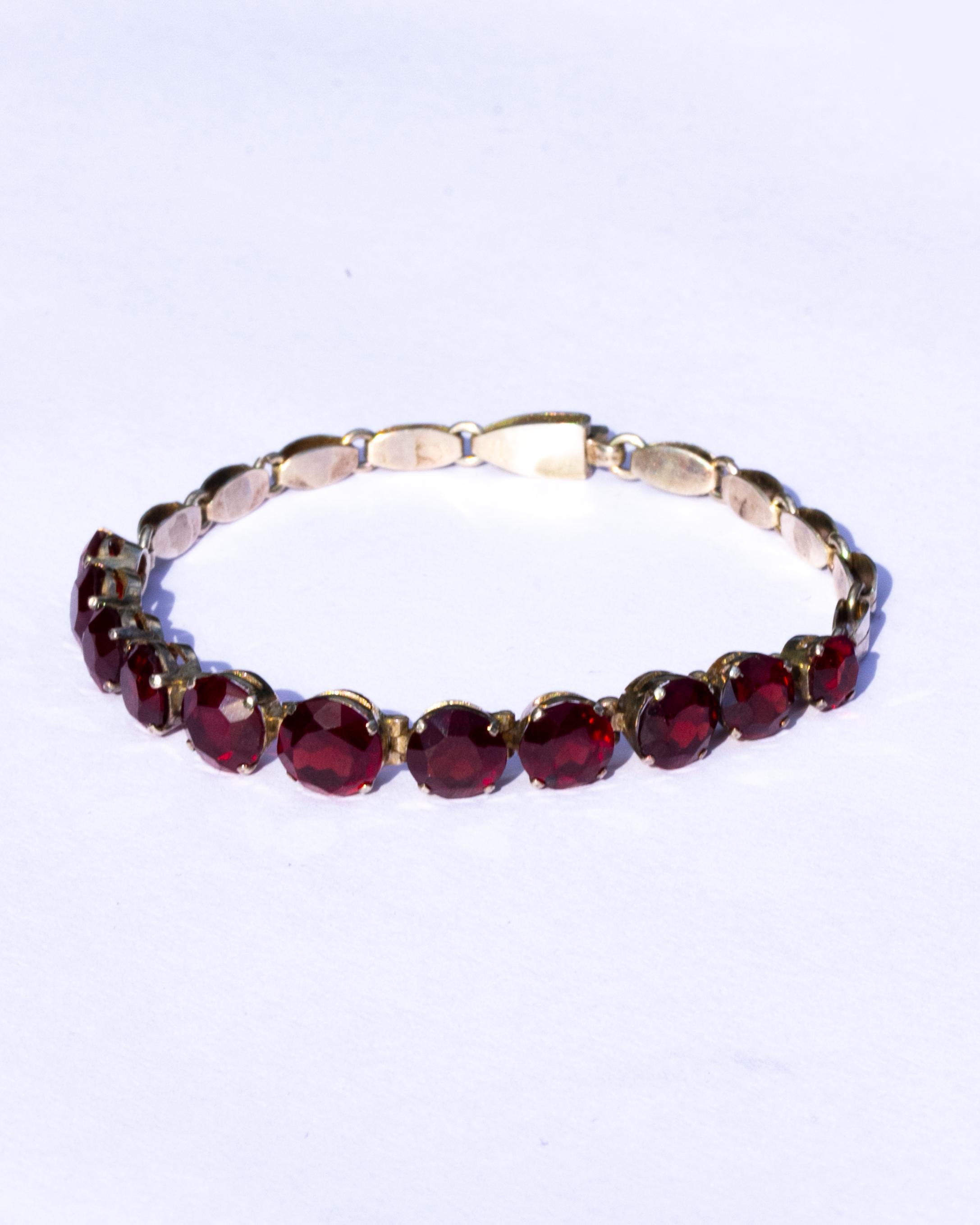 This gorgeous bracelet holds orbs of cut garnet which catch the light beautifully. This bracelet and the stones are all set and modelled in silver. The widest stone measures 8mm and the smallest measures 3.5mm. 

Length: 18.5cm
Width: 8mm

Weight: