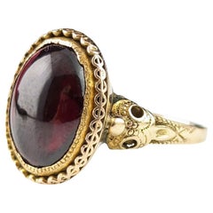 Antique Garnet cabochon ring, 18k gold, Bird mask, Edwardian 