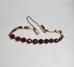 Antique Garnet Link 9 Karat Yellow Gold Bracelet with Safety Chain