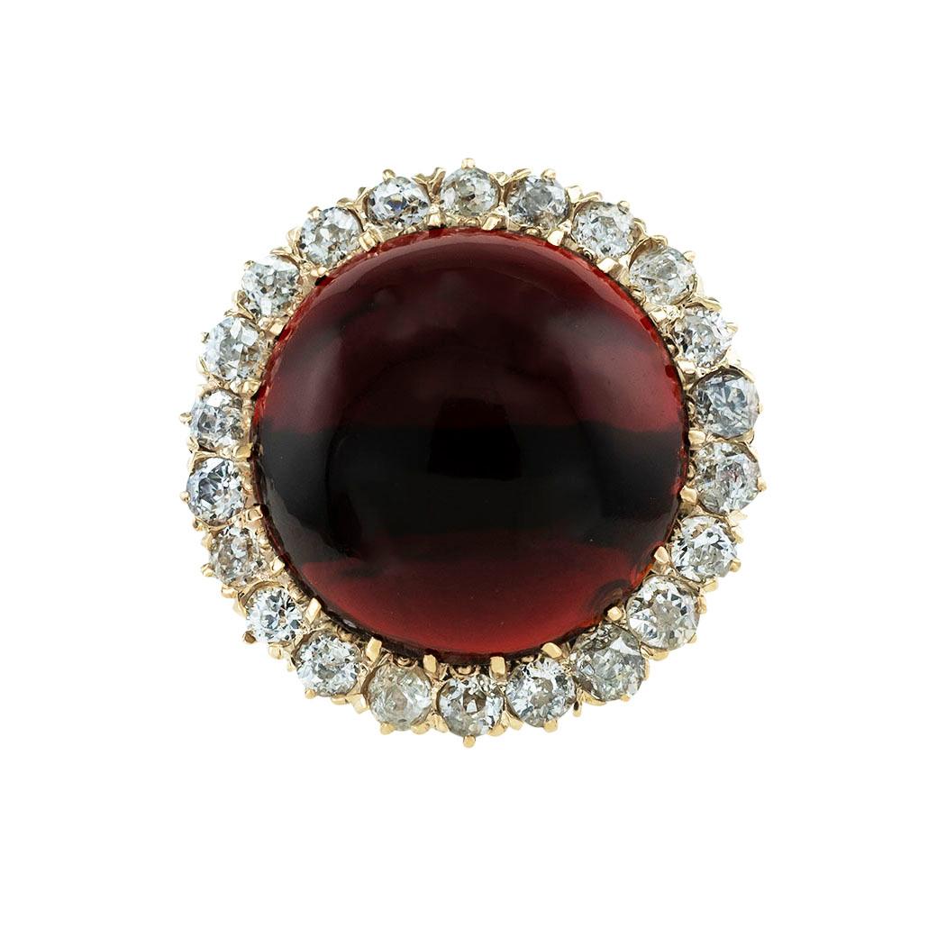 Antique garnet old mine-cut diamonds and gold ring circa 1900. *

ABOUT THIS ITEM:  #R-DJ68K. Scroll down for specifications.  The large round cabochon garnet shows a nice shade of red reminiscent of a dark ripe cherry, framed by old mine-cut